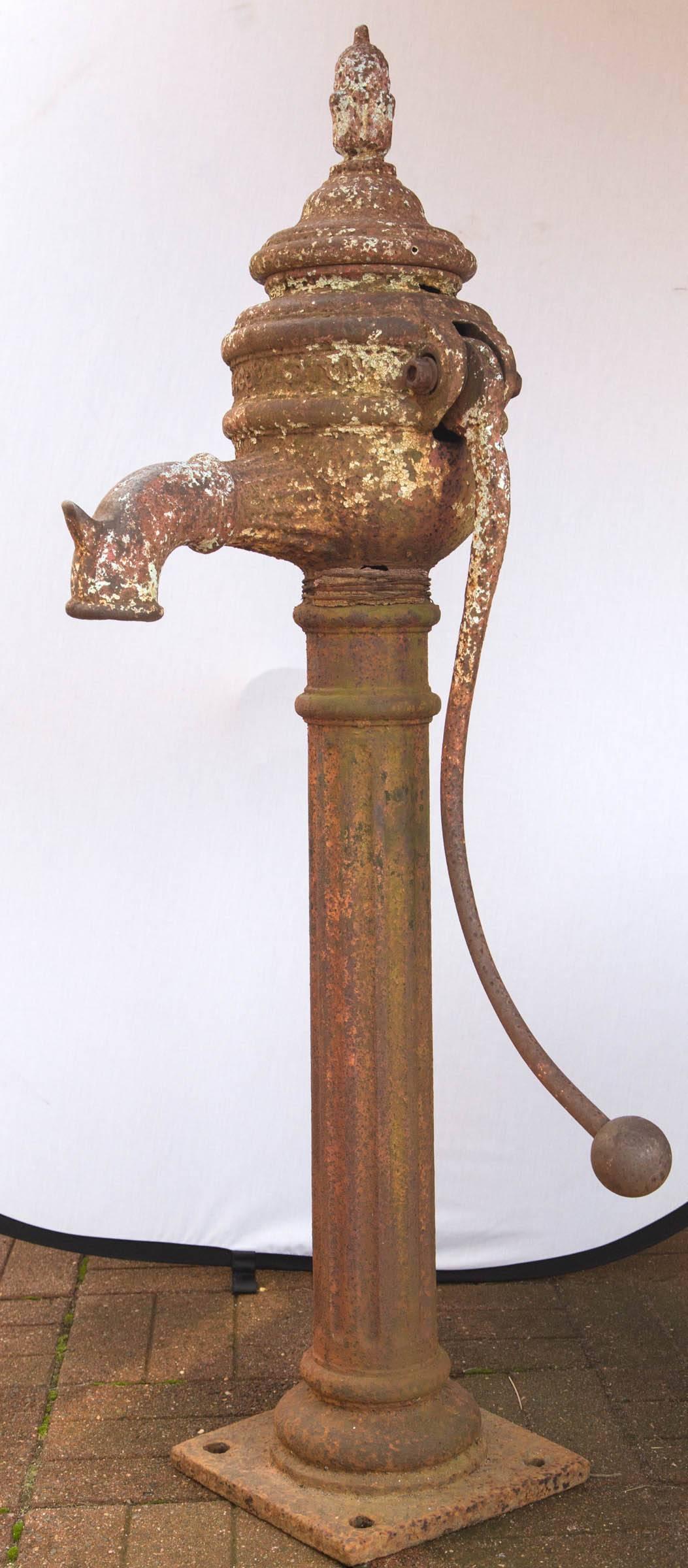 Vintage Irish cast iron water pump signed George Espey Cookstown Co. The lid removes to show inside mechanism. There is a hole on left side of pump.