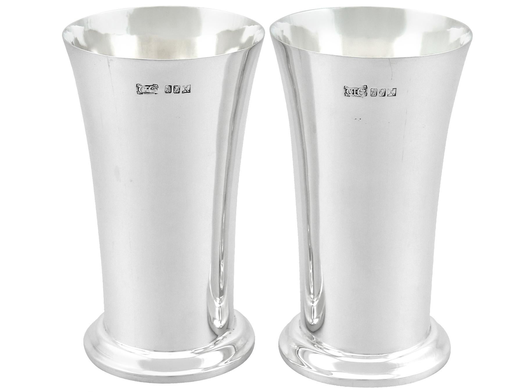 An exceptional, fine and impressive pair of vintage Irish sterling silver vases / beakers made by William Egan & Sons; an addition to our ornamental silverware collection.

These exceptional vintage Irish sterling silver vases/beakers have a