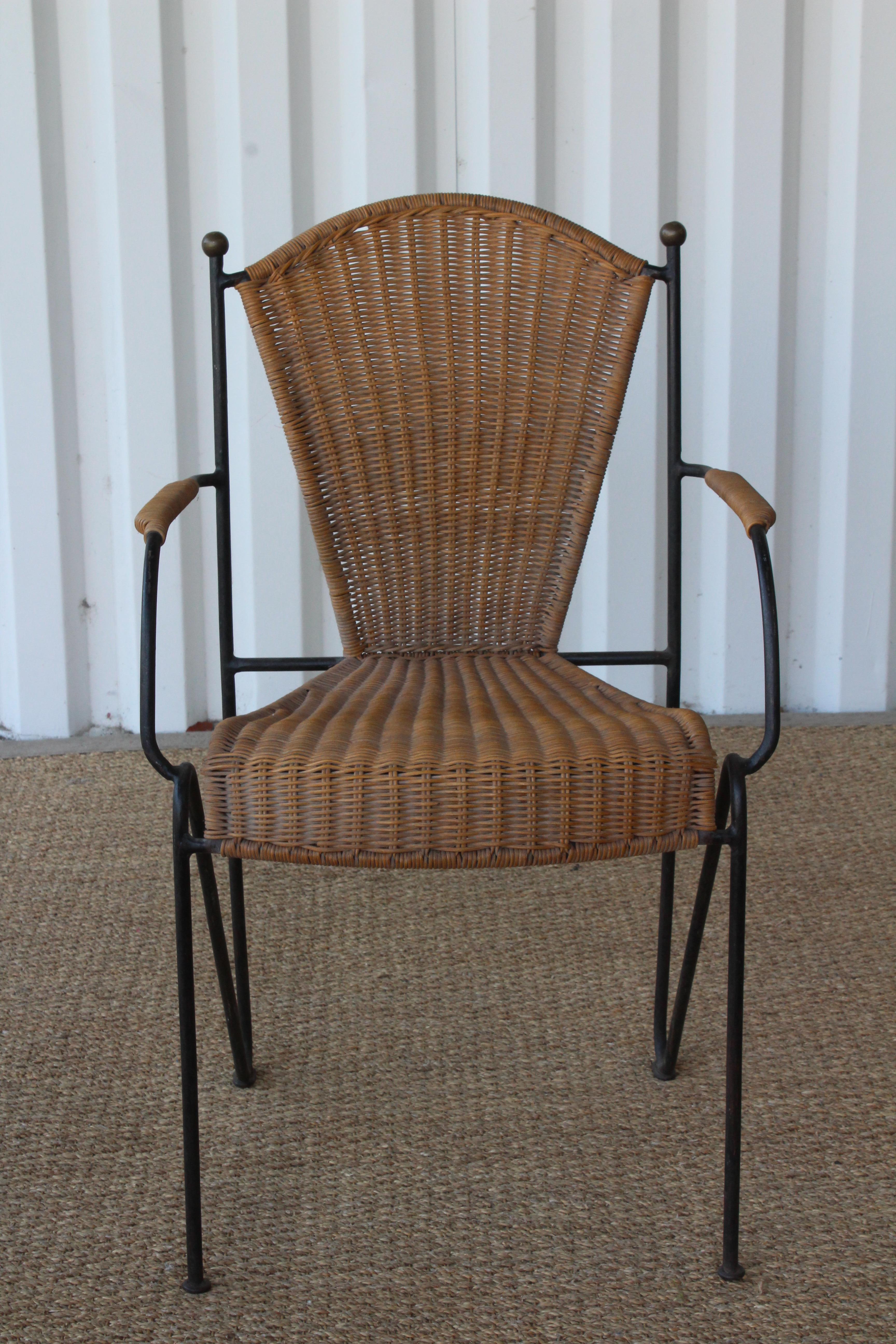 Vintage iron and woven wicker armchair, France, 1950s. New handwoven wicker. Brass ball details on the back. In overall excellent condition. Measures: 25