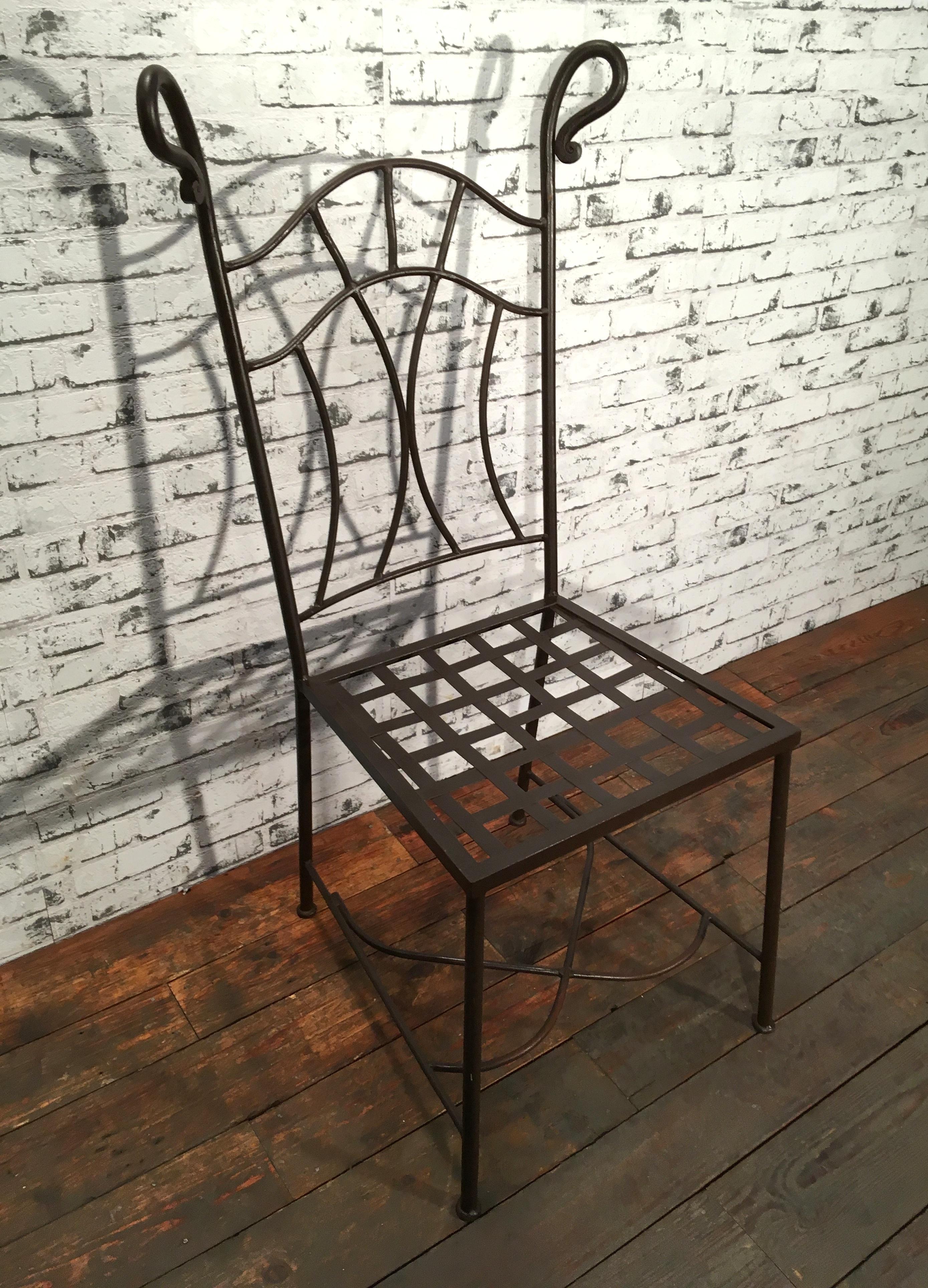 Vintage iron chair made by an art blacksmith during the 1930s. 
Weight of the chair is 7 kg.
Dimensions of the seat : 44x41 cm