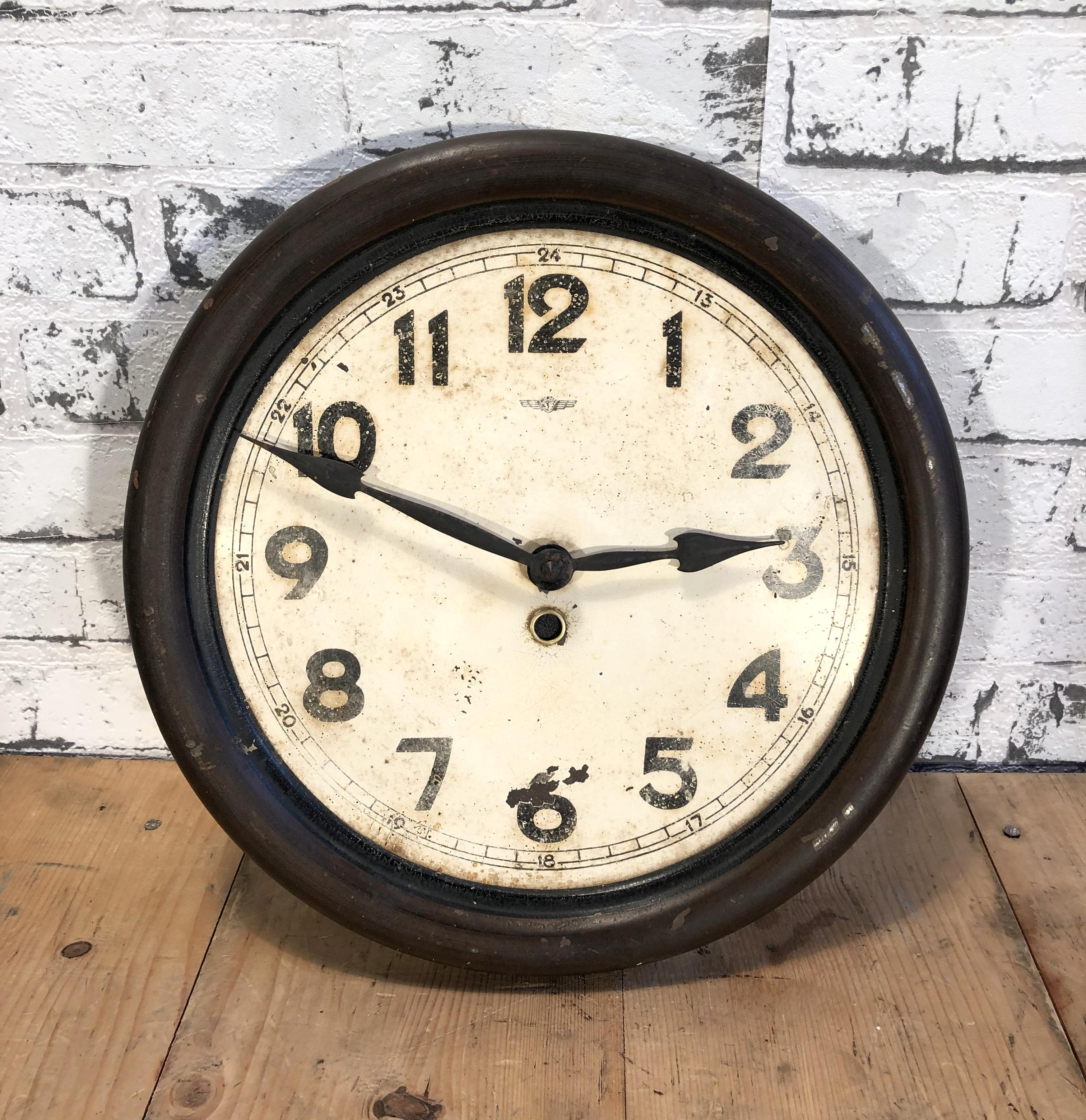 Vintage iron clock manufactured by Kienzle Clock during the 1930s.The piece has been converted into a battery-powered clockwork and requires only one AA-battery. Diameter 30 cm.