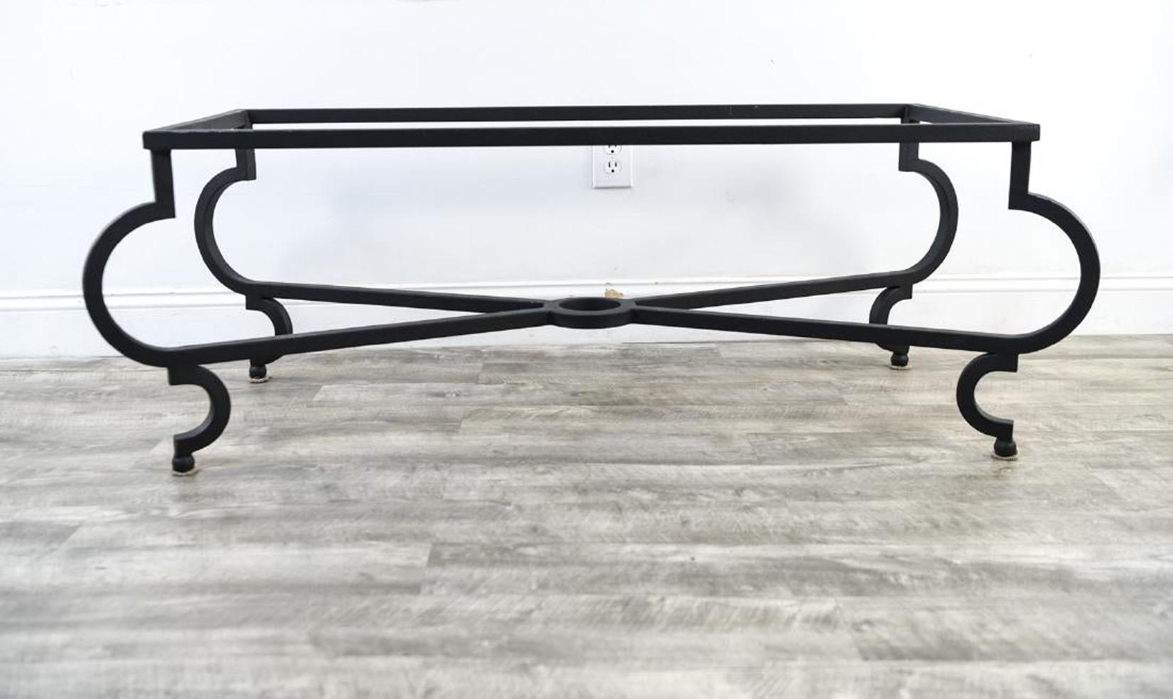 Black metal coffee table base, add your own stone, wood or glass top. Table legs with volute scrolled shape and cross stretcher connected by a circular ring. Elegant silhouette, this coffee table base will bring a stylish touch to any home,