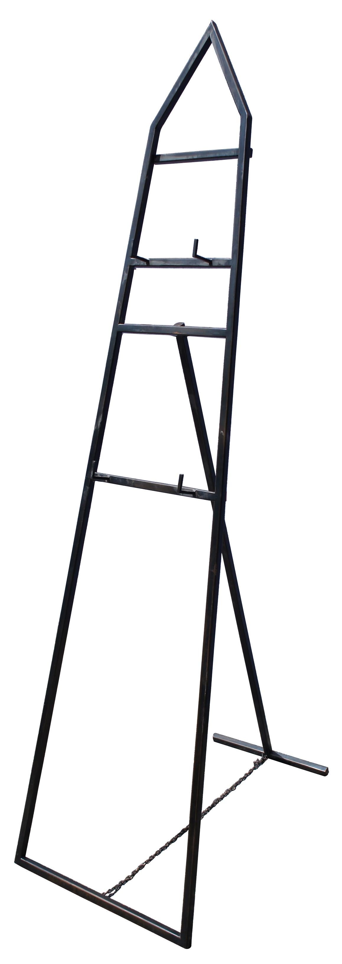 Black metal obelisk shaped display stand with two easel shelves for displaying multiple pieces of art. Measure: 74