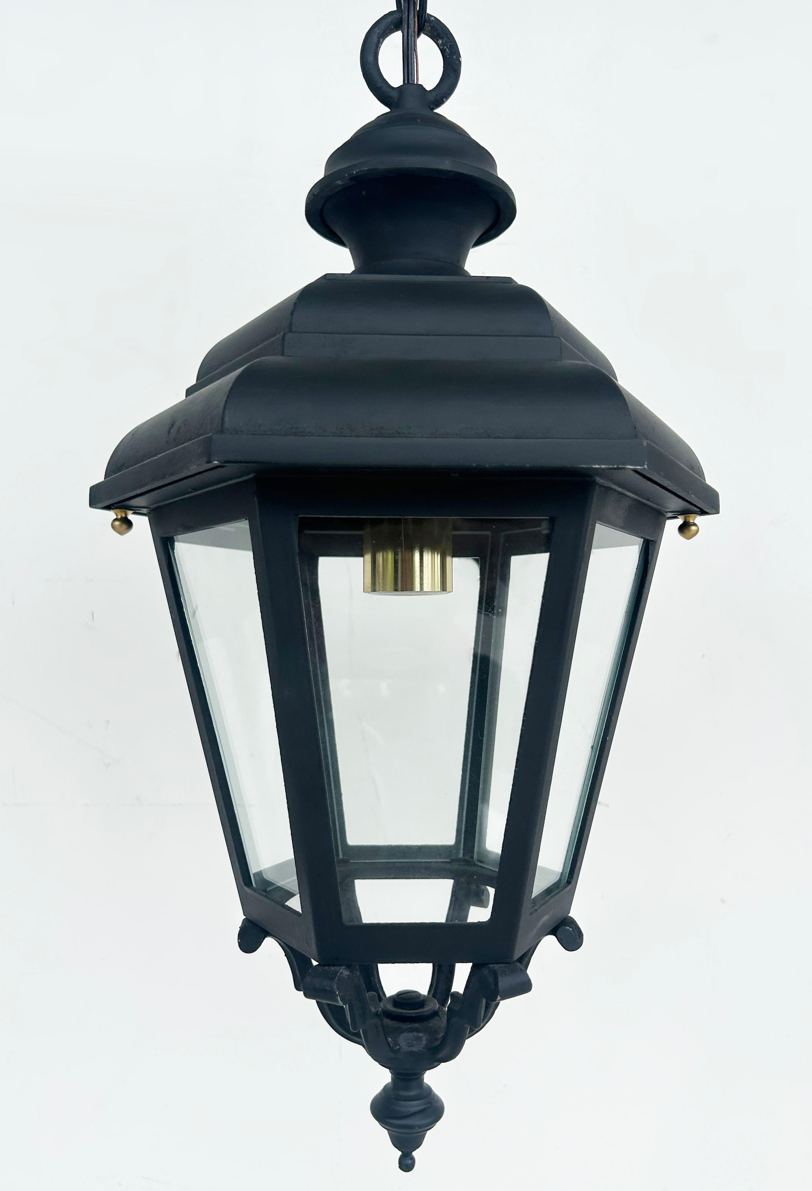 Vintage Iron, Glass Exterior Pendant Lantern Light Fixture, Restored 

Offered for sale is a restored and rewired hexagonal iron, glass, and brass outdoor pendant light fixture or lantern with a porcelain socket.  This completely restored fixture
