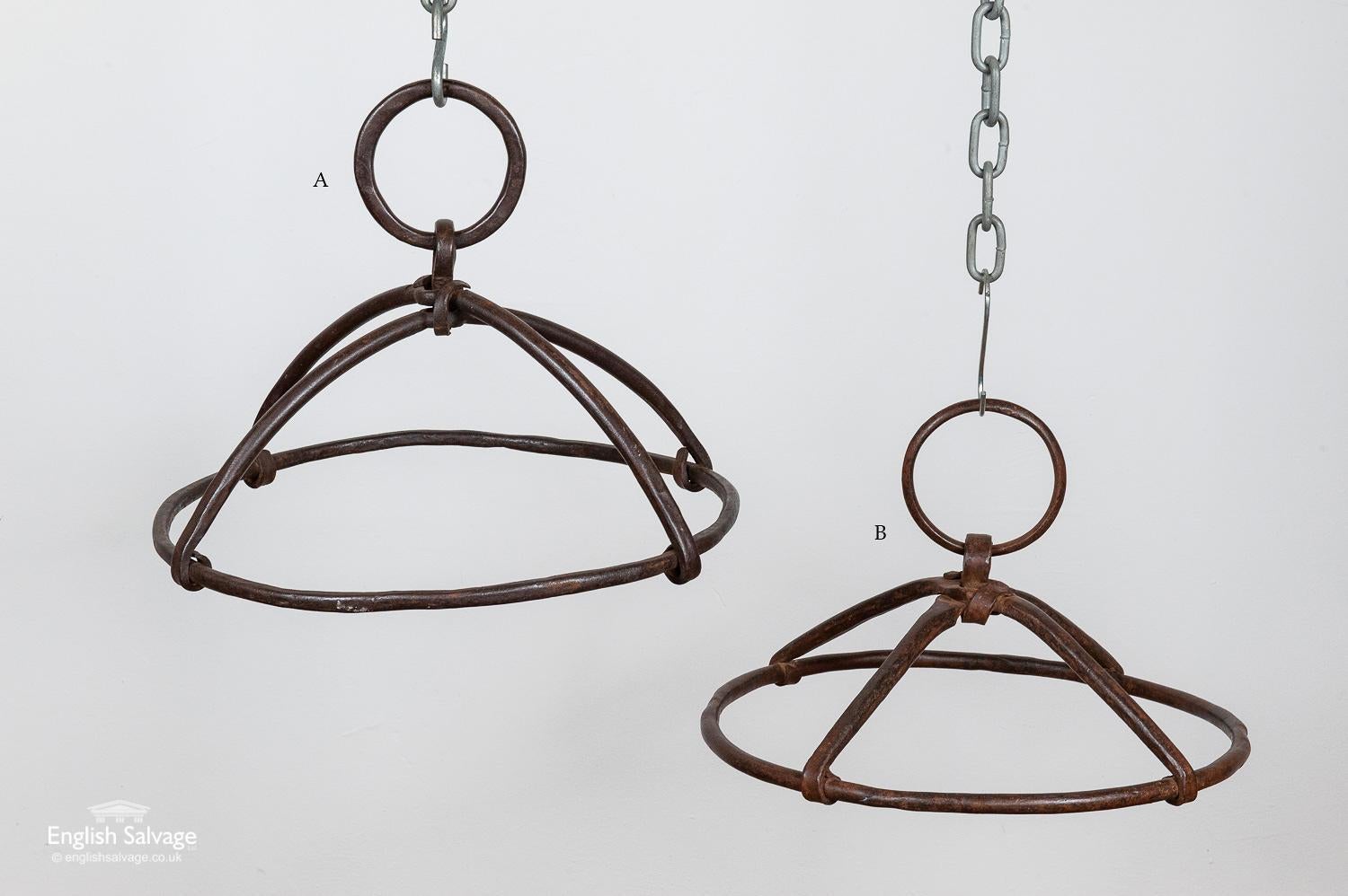 These vintage rustic iron ceiling hangers could serve a multitude of uses, in the kitchen, garden or in a retail setting. They are made from sturdy wrought iron and have a well-weathered finish. 'A' is sold. 'B' measures: 41cm diameter x 17cm high