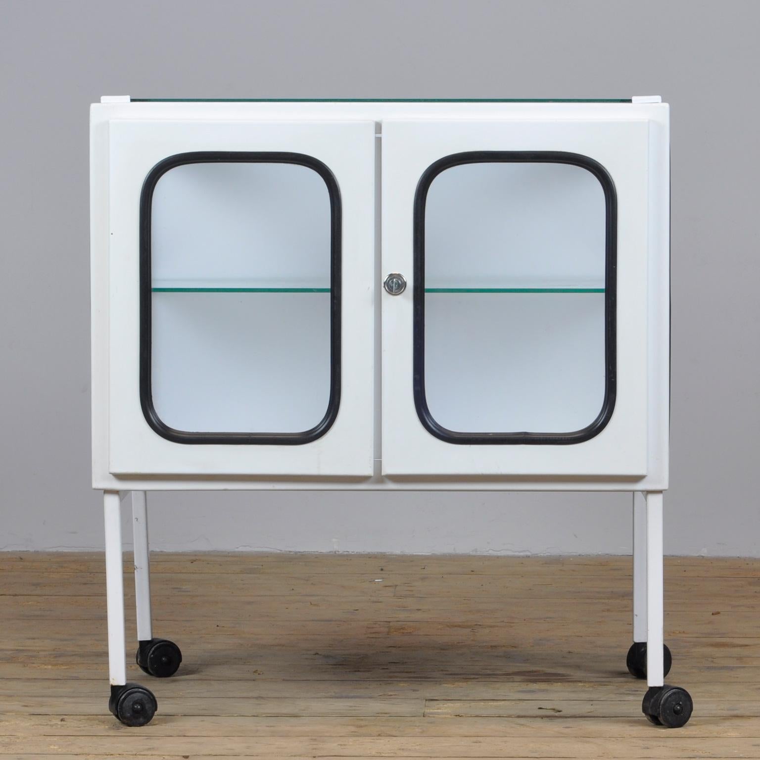 Vintage medical trolley in good condition. Made of steel and glass that is clamped in the steel by a rubber strip. The cabinet is from the 1970s and is produced in Hungary.