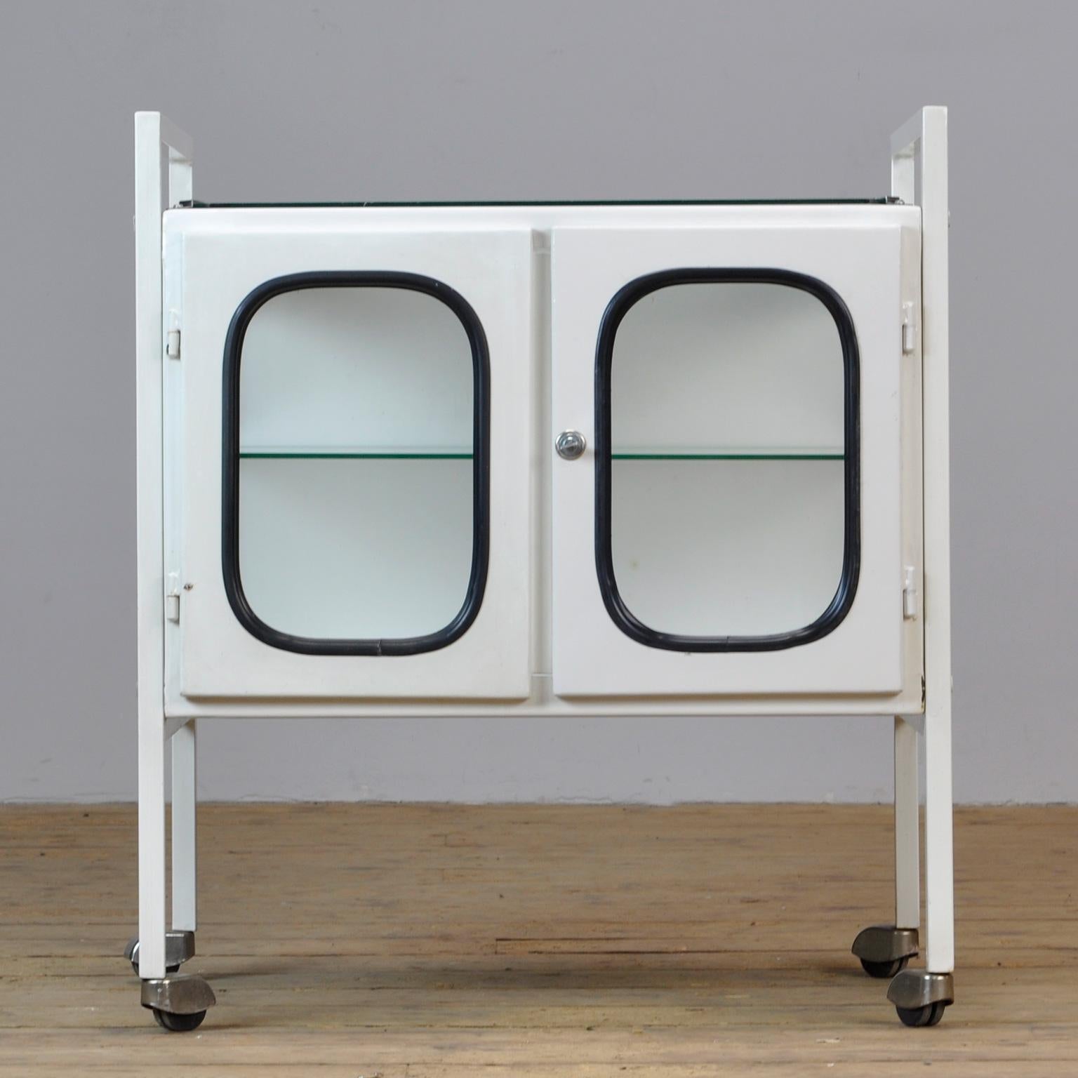 Vintage medical trolley in very good condition. Made of steel and glass that is clamped in the steel by a rubber strip. The trolley is from the 70s and is produced in Hungary.
Height of the glass top is 83cm.
