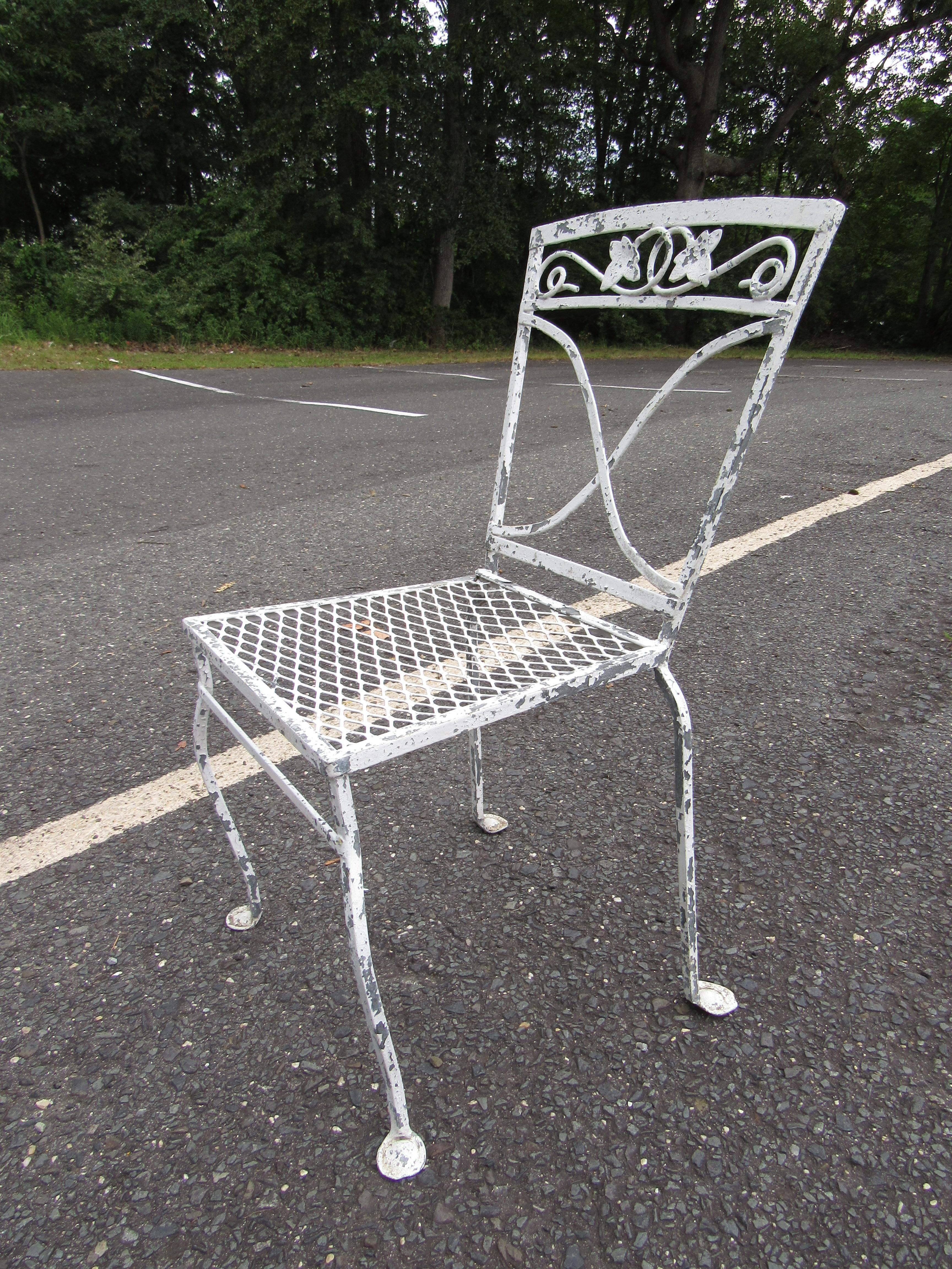 Impressive set of vintage patio dining chairs. Sturdy iron construction. Great addition to any outdoor/patio area's seating arrangement. Please confirm item location with dealer (NJ or NY).
