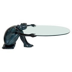 Vieille sculpture en fer & Table basse en verre