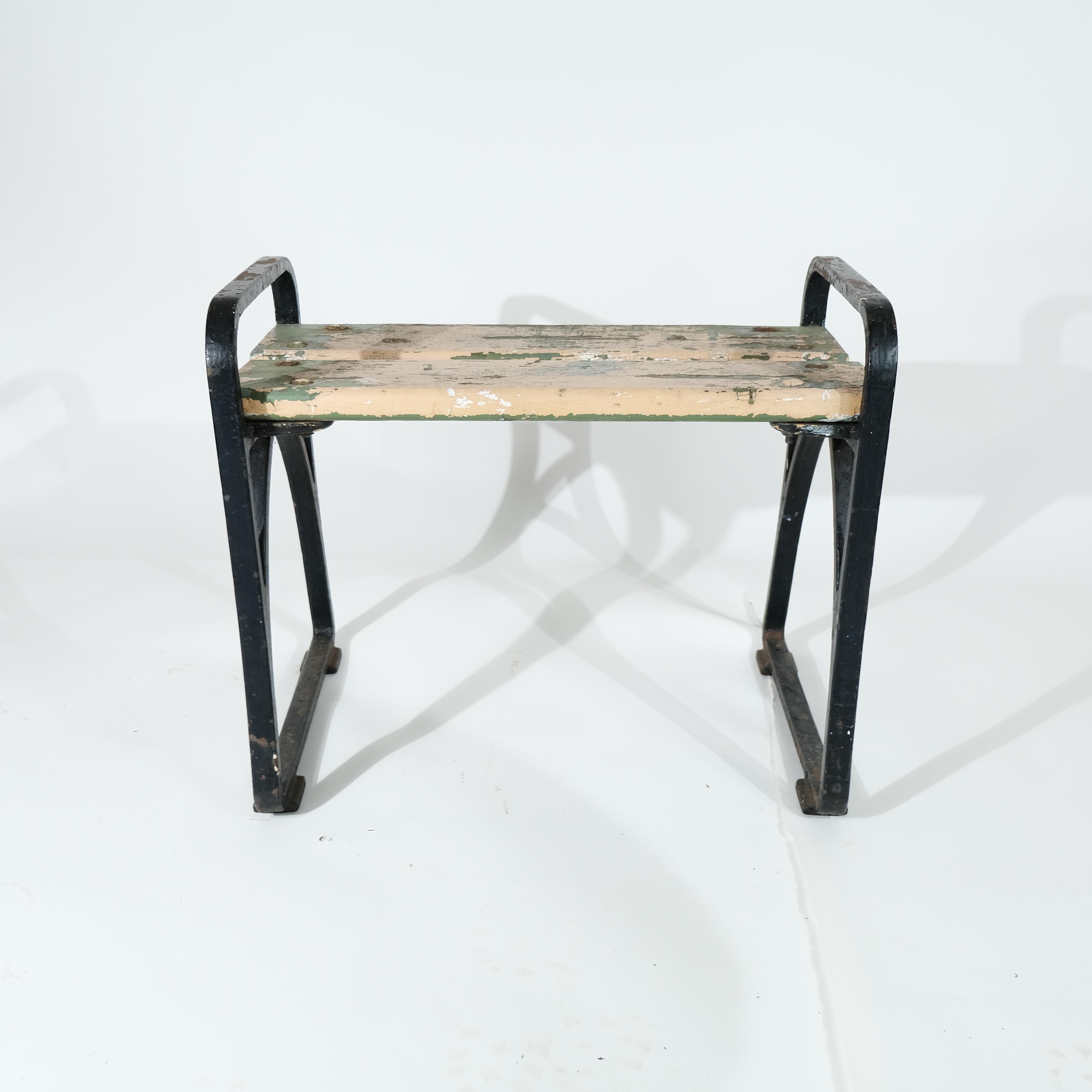 A Swedish stool cast in iron with wood seating in untouched condition. Swedish grace and made around 1930-1940. Perfect for indoors or outdoors use. Designer is unknown but it is a strong design. Seating height ca 43 cm.
