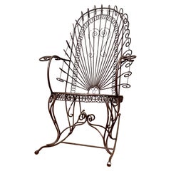 Sedia a dondolo vintage con struttura in ferro