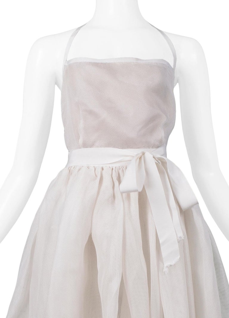 whose innovation is the silk gazar dress SILK GAZAR GOWN WITH POCKETS AND RIBBON EMBROIDERY ANGEL SANCHEZ