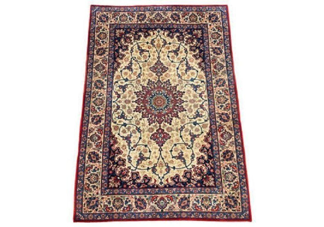 A beautiful vintage Isfahan rug handwoven circa 1940 with a concentric medallion on an ivory field and secondary colours of reds and blues. Very finely woven (9x9 knots per centimetre) with exceptional quality Kurk wool.

Size: 1.55m x 1.09m (5ft