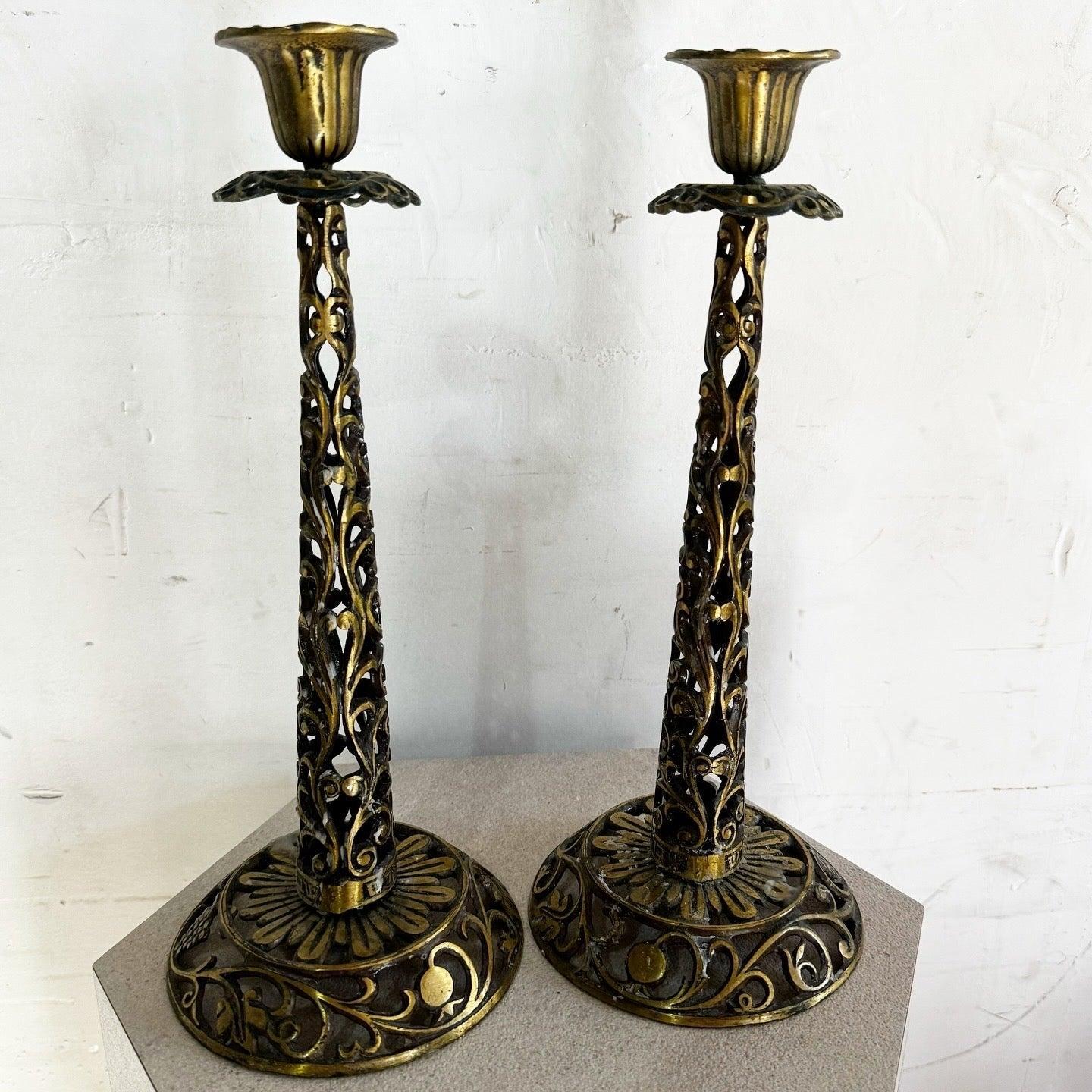 Vintage Israeli brass Shabbat candlesticks by Oppenheim with intricate filigree designs and warm brass finish. Ideal for Shabbat observance or decor.
 
 We sell items as acquired, without restoring or repairing. Vintage pieces may have age-related