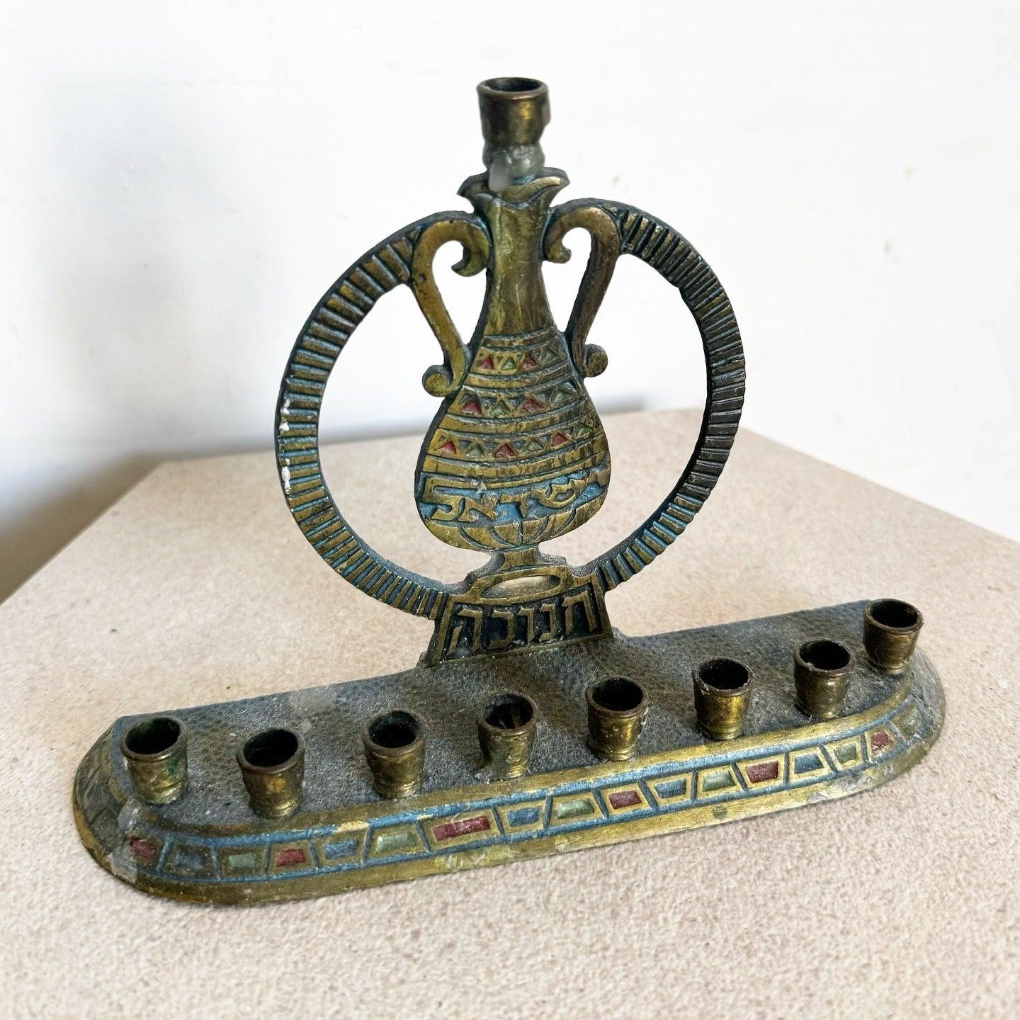 Vintage Israeli Brass Yisrael Menorah with hammered texture, enamel accents, and “Yisrael” motif. Perfect for Hanukkah or decorative use.
 
 We sell items as acquired, without restoring or repairing. Vintage pieces may have age-related wear. Review