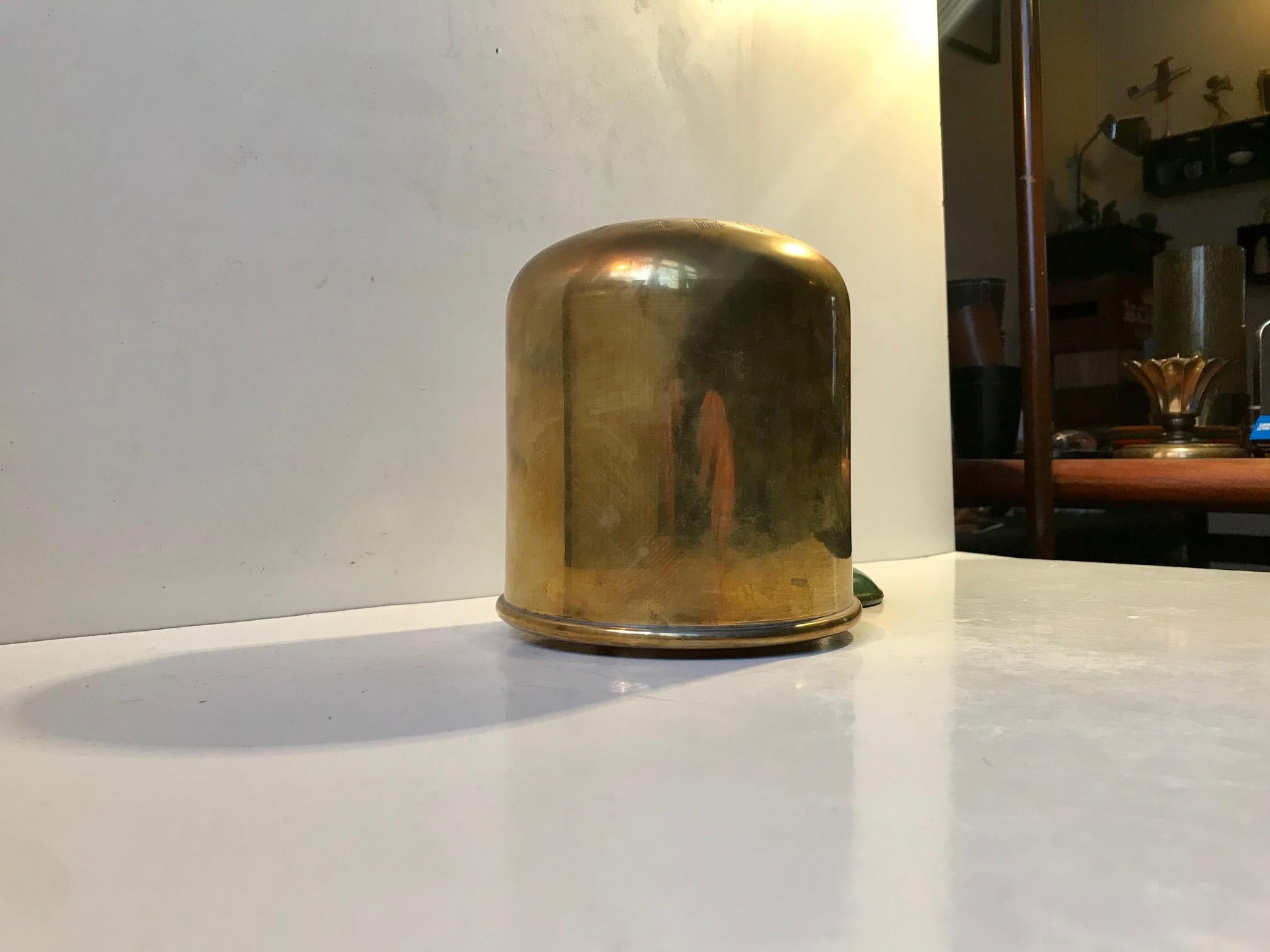A wall hung church money bank in brass. It reads Tabor to its front - incised by hand. Presumably it has been used for tithing at one the churches of Mount Tabor in Israel. It was made sometime between 1900-1940.