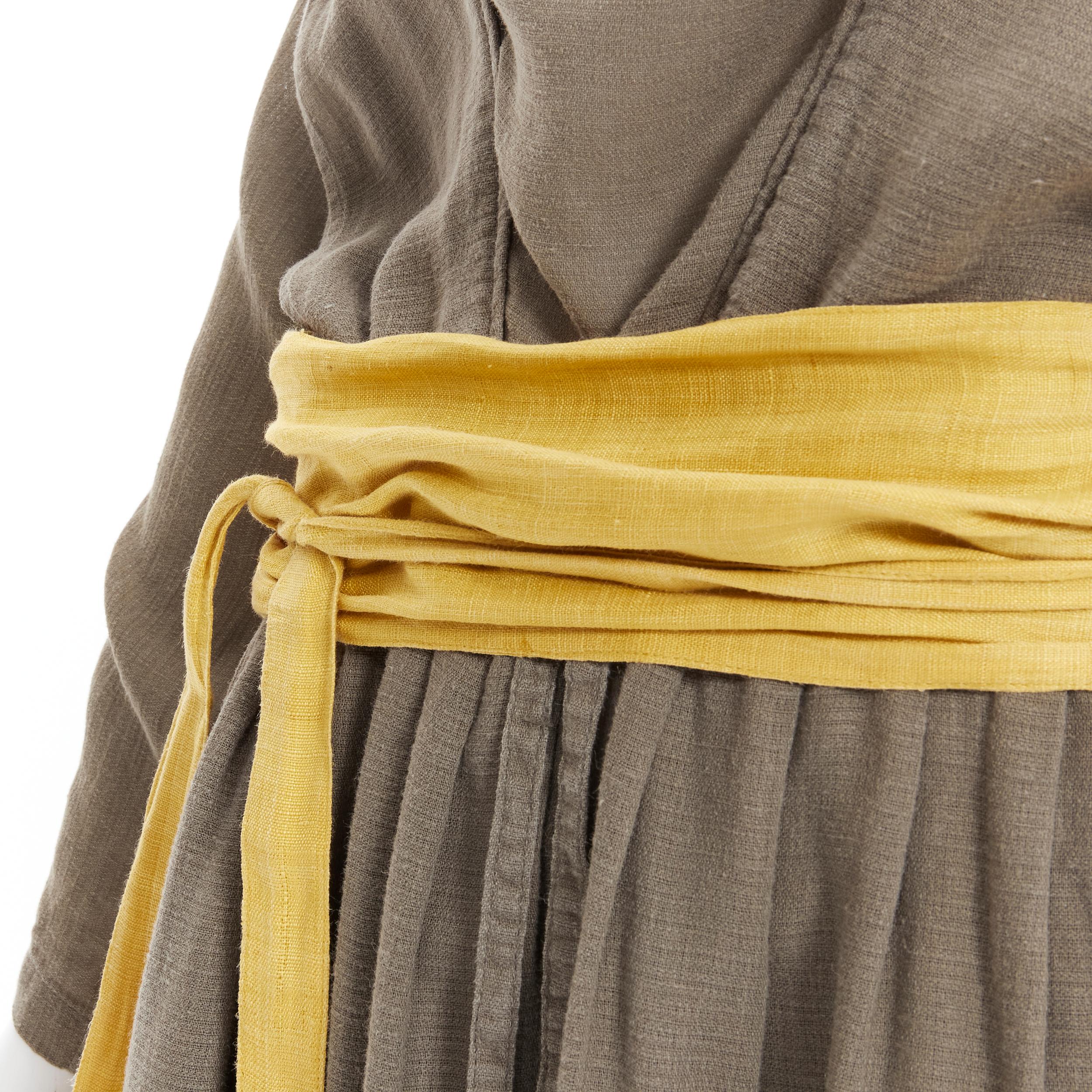 vintage ISSEY MIYAKE 1980's beige linen yellow obi belt cowl neck dress M rare 
Reference: TGAS/B00802 
Brand: Issey Miyake 
Designer: Issey Miyake 
Collection: 1980's 
Material: Linen 
Color: Beige 
Pattern: Solid 
Extra Detail: Obi tie belt. Cowl