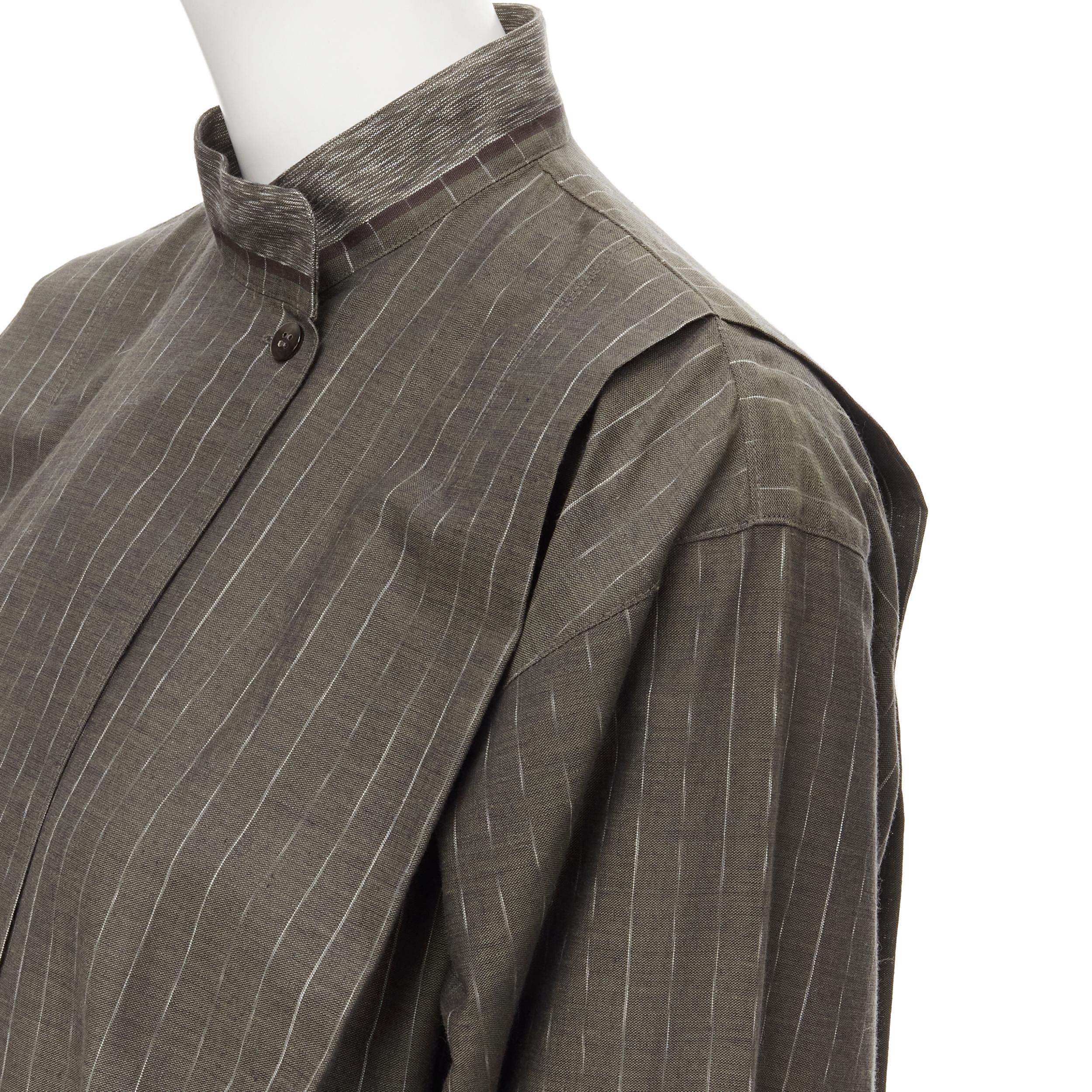 vintage ISSEY MIYAKE 1980s green striped cotton Samurai pleat shirt Sz. 9 M 
Reference: CRTI/A00423 
Brand: Issey Miyake 
Collection: 1980's 
Material: Cotton 
Color: Green 
Pattern: Striped 
Closure: button 
Extra Detail: Stand collar. Concealed