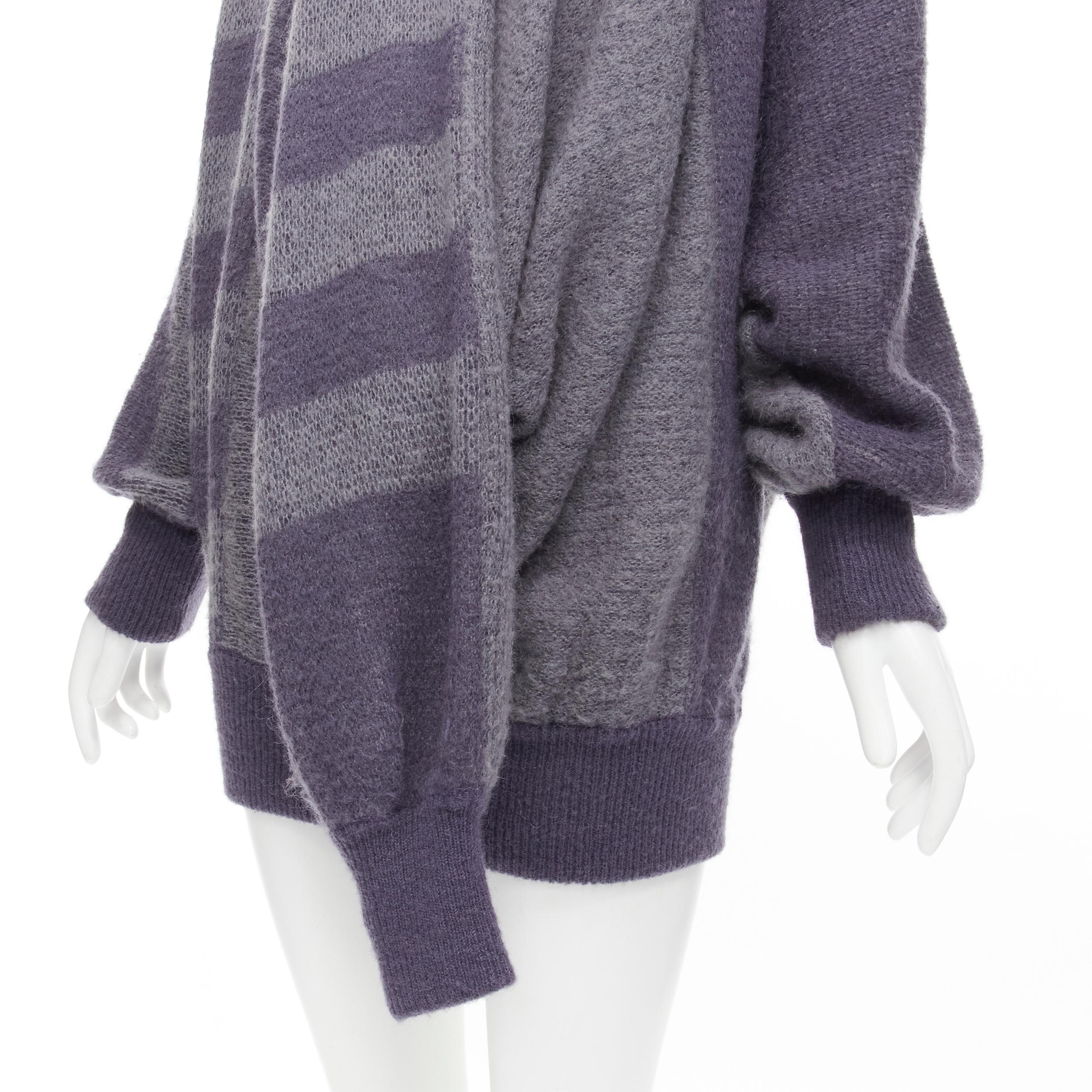 vintage ISSEY MIYAKE 1980s purple striped 3 sleeve draped turtleneck sweater dress M 
Reference: CRTI/A00521 
Brand: Issey Miyake 
Collection: 1980s 
Material: Wool 
Color: Purple 
Pattern: Striped 
Extra Detail: Turtleneck. 3-sleeve design. 
Made