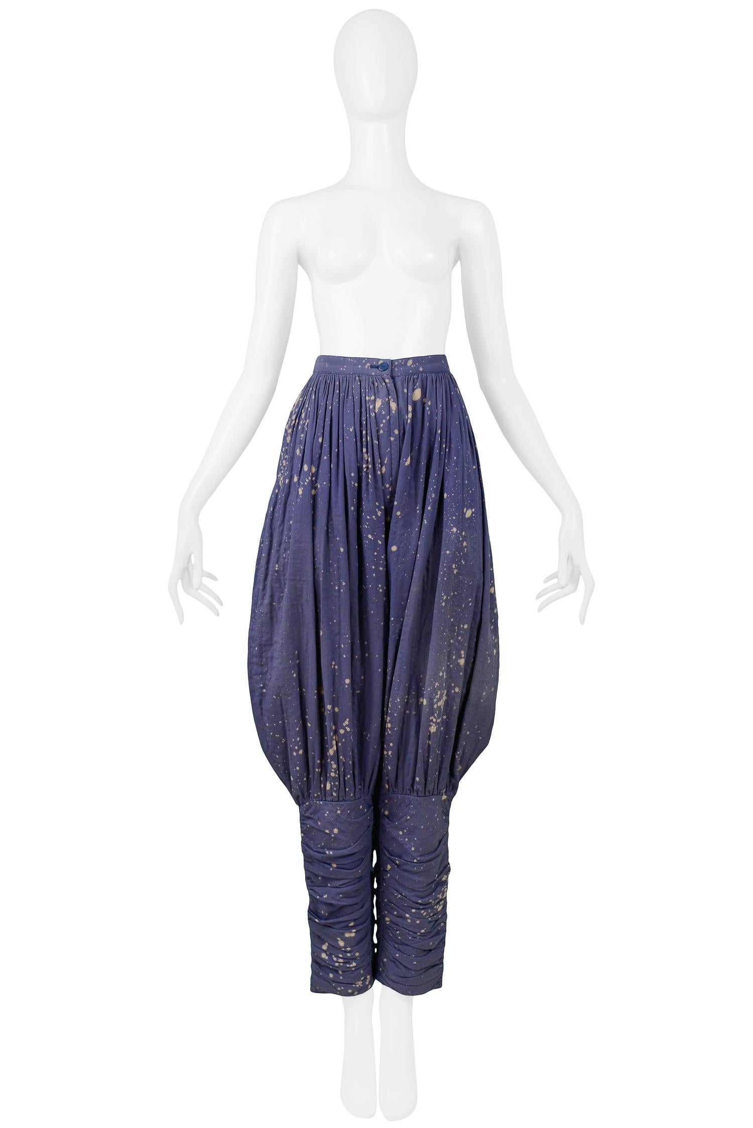 Vintage Issey Miyake indigo blue jodhpur pants featuring bleach splatter detail and gathering throughout.

Excellent Condition.

Size 2

Measurements
Waist 26