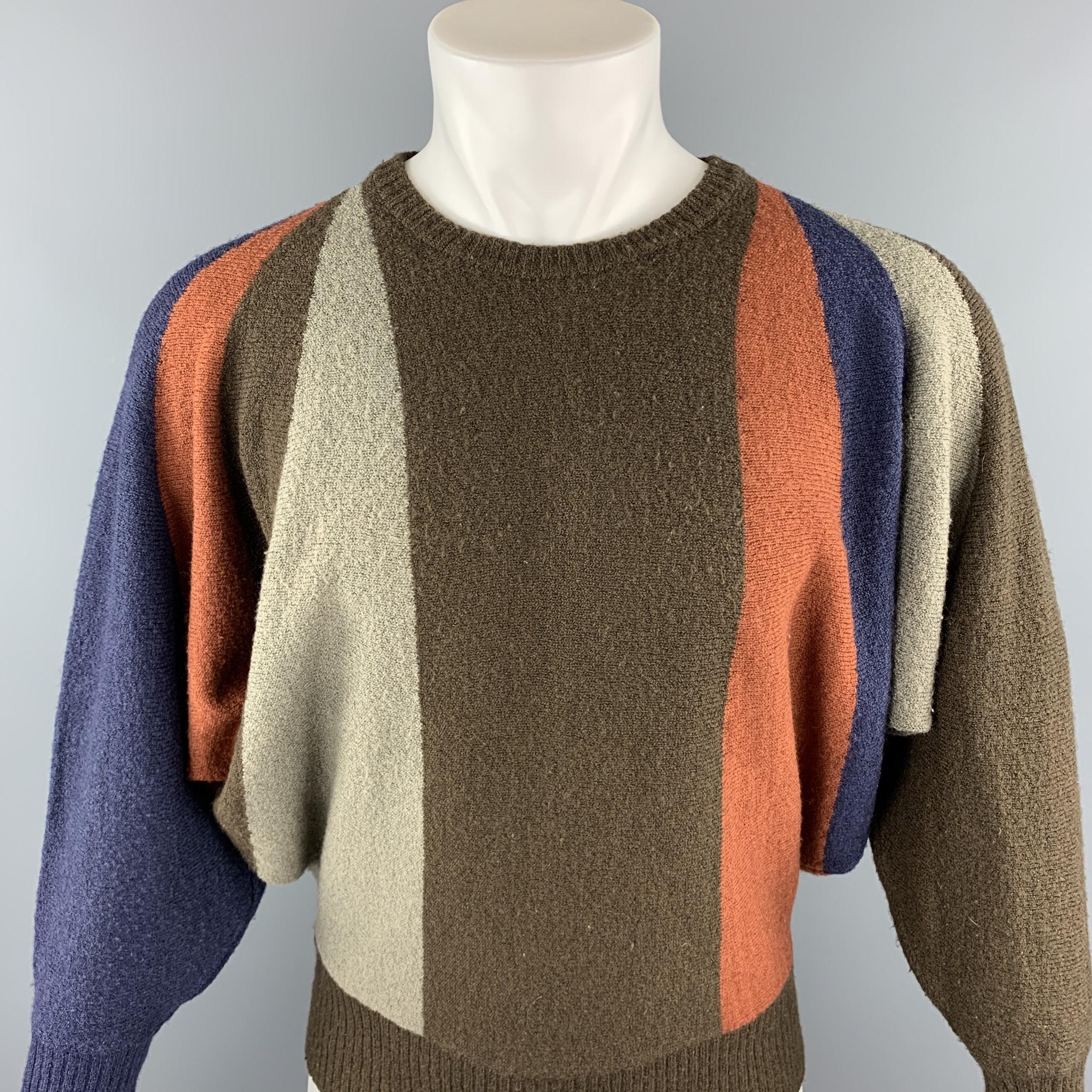 Vintage ISSEY MIYAKE sweater comes in a multi-color wool blend featuring bat wing sleeves and a ribbed crew-neck. 

Very Good Pre-Owned Condition.
Marked: No size marked

Measurements:

Shoulder: 19 in. 
Chest: 54 in. 
Sleeve: 22 in. 
Length: 24.5