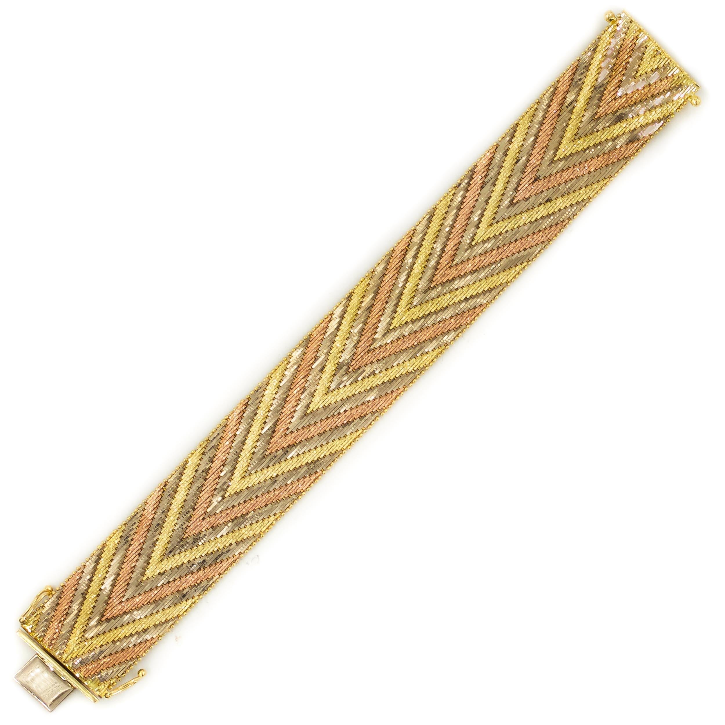 VINTAGE 14K SOLID YELLOW, WHITE AND ROSE GOLD CHEVRON PATTERNED BRACELET
With a slinky flexible profile  75.5 grams total weight  circa 1940-60
Item # 111RIK03X 

A very fine chevron patterned flexible-link bracelet executed in solid 14k rose,
