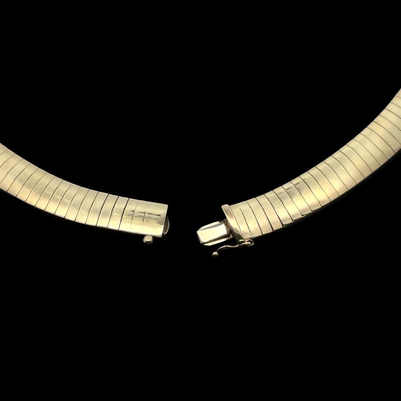 Material: Solid 14k Yellow Gold
Weight: 50.37 Grams
Chain Type: Flexible Omega - Push clasp with safety latch
Overall Length: 16.0” (measured on a neck)
Overall Width: 8.1mm (0.32
