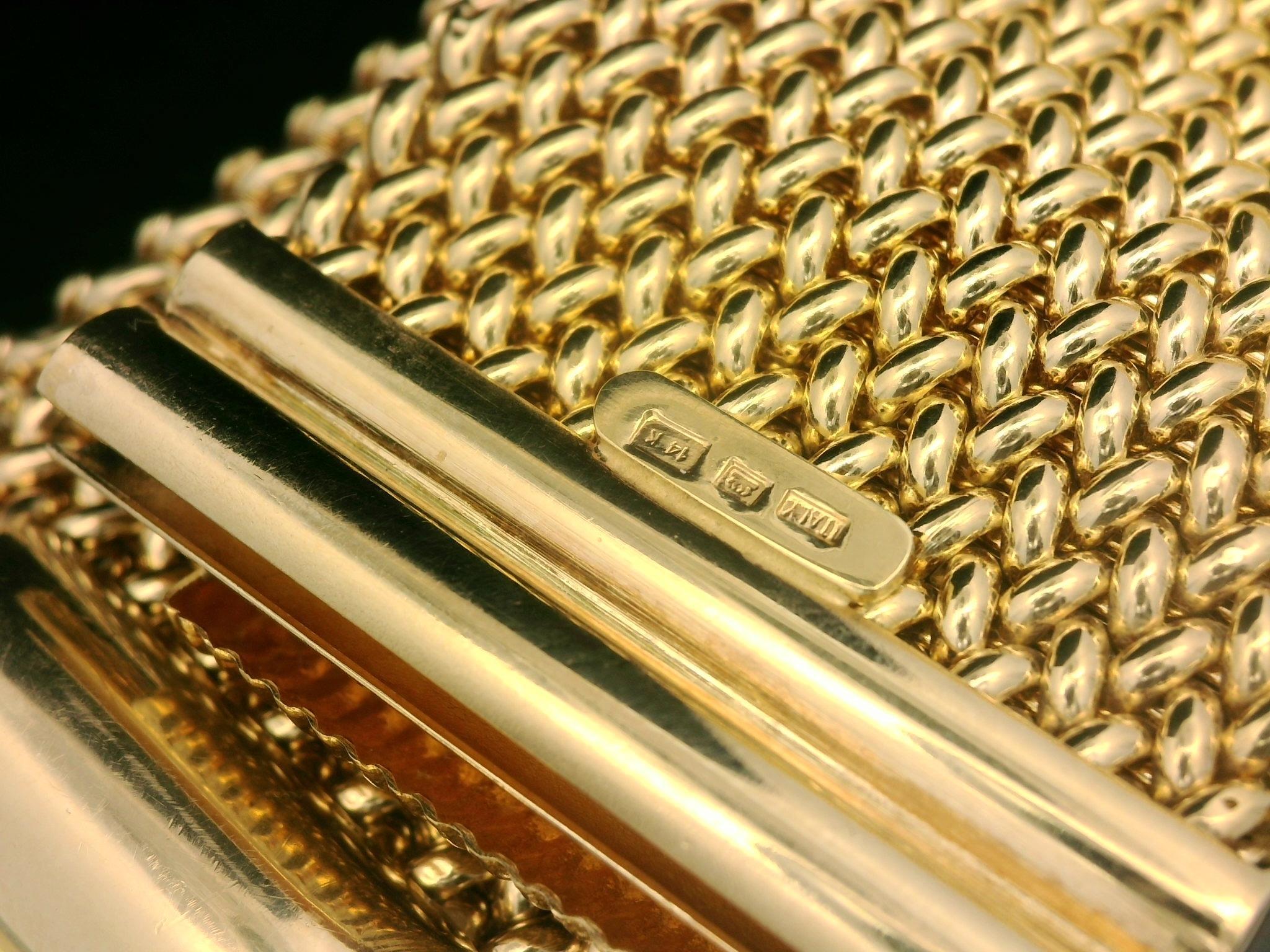 Material: Solid 14k Yellow Gold
Weight: 60.93 Grams
Chain Type: Woven Mesh Link
Chain Length: Measures 8 Inches Next to a Ruler. Will Comfortably Fit up to 7.5 inches Wrist (fitted on a wrist).
Chain Width: 33.4mm (1.3