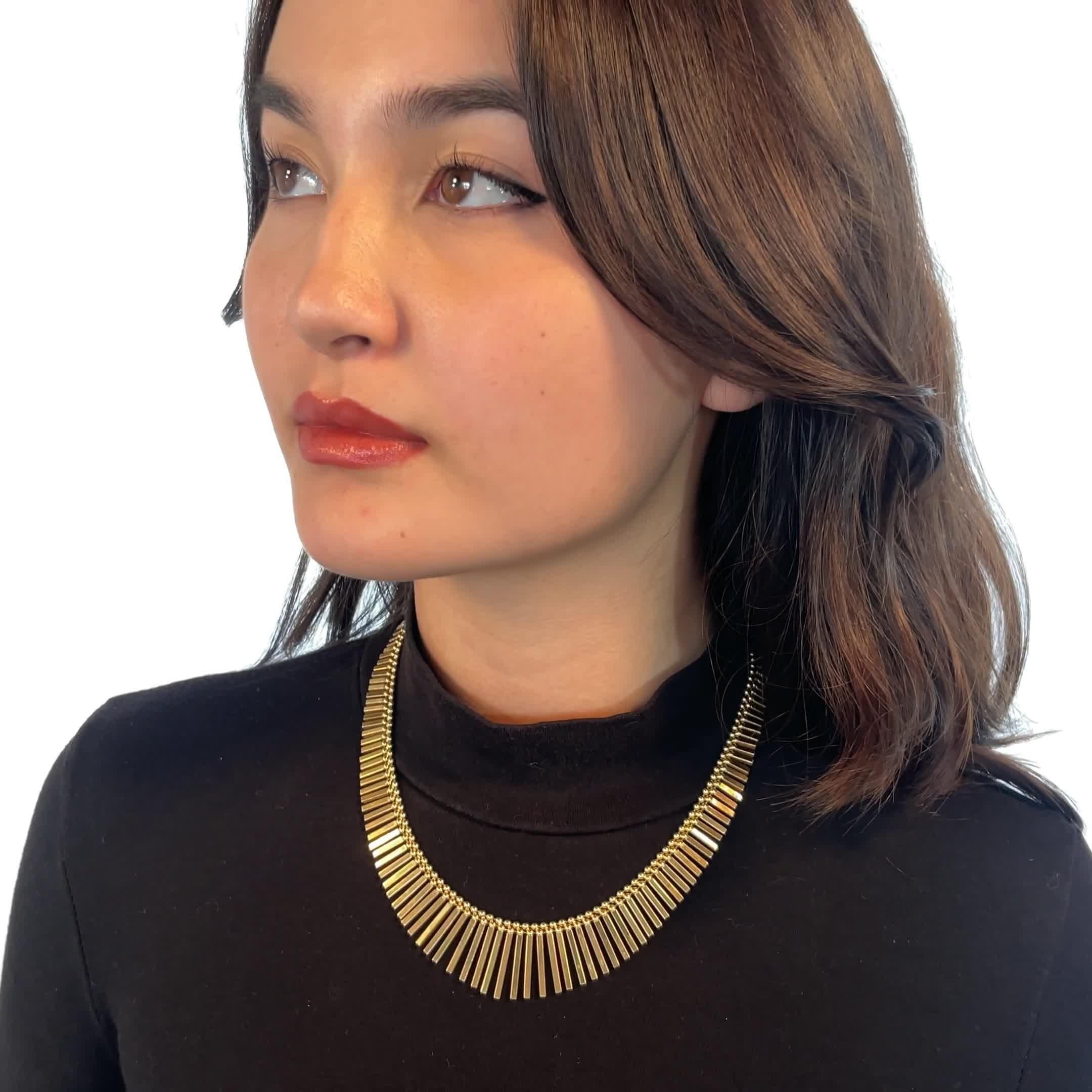 Vintage Italian 18 Karat Gold Fringe Collar Necklace. Italian hallmarks. Circa 1980s. 17 inches. 

About The Piece: Do you like to stay on top of fashion trends? Solid gold pieces are a hot trend these days. This stunning Vintage Italian 18 Karat