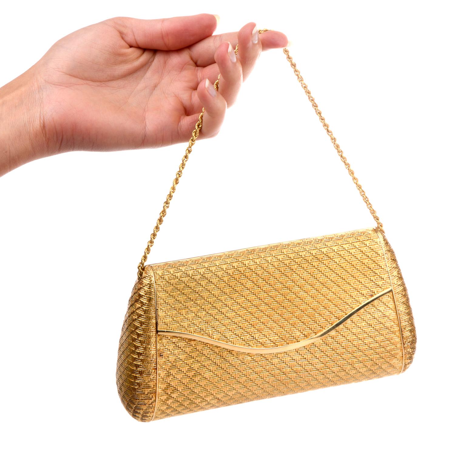 This exquisite Vintage Italian 1960's Clutch Purse was inspired with a soft textured 18k rope chain strap. Elegantly patterned with a hidden mirror in the interior and crafted in 408.6 grams of 18K yellow gold.  
Measures approximately 4in tall x