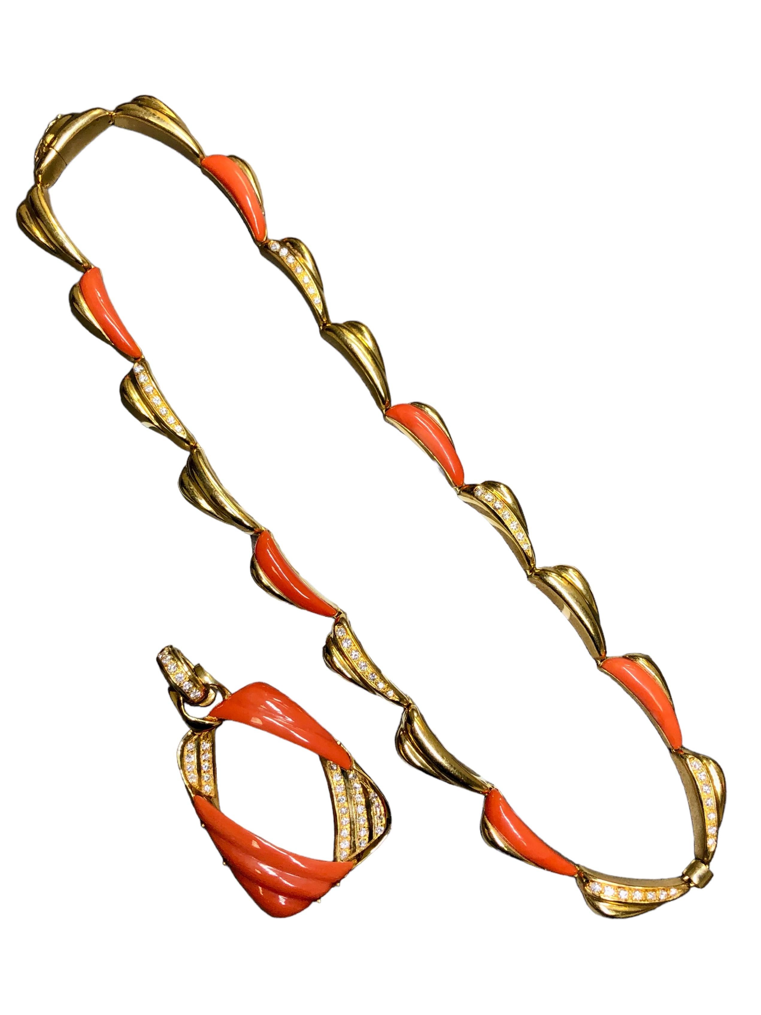 
A beautiful Italian made necklace done in 18K yellow gold with perfectly matched carved coral inlaid throughout as well as approximately 1.42cttw in F-G color Vs1-2 clarity round diamonds. The pendant does separate from the necklace so that you can