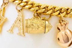 Uno-a-Erre Bracelet italien vintage en or 18 carats avec breloques en or 14 carats