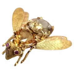 Broche vintage italiano de oro de 18 quilates con cuerpo de gema de citrino y ojos de rubí