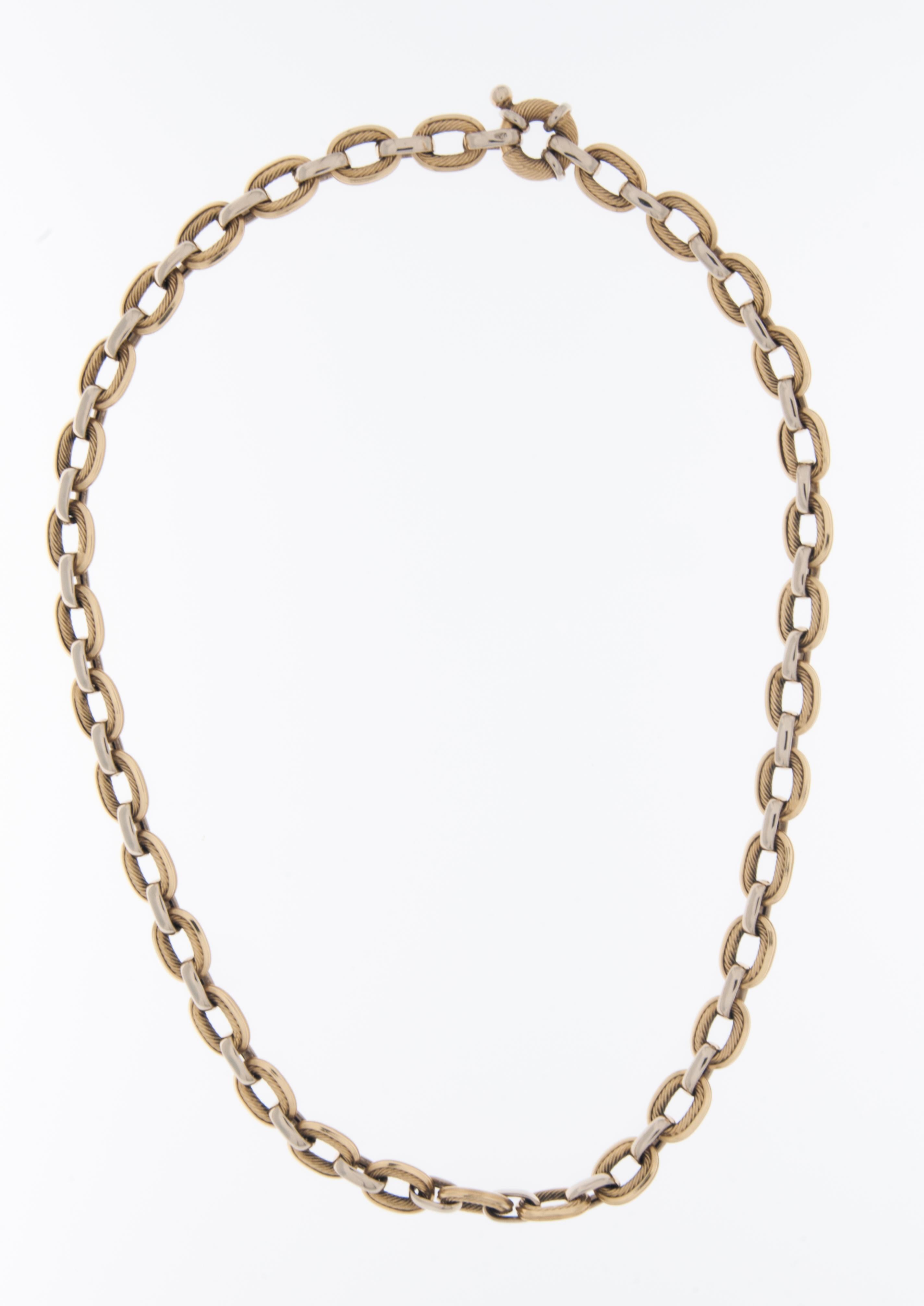 The Vintage Italian 18kt Gold Necklace is a distinctive and timeless piece of jewelry that reflects the craftsmanship and artistry of Italian design. Crafted from high-quality 18-karat yellow and white gold, this necklace exudes a warm and rich