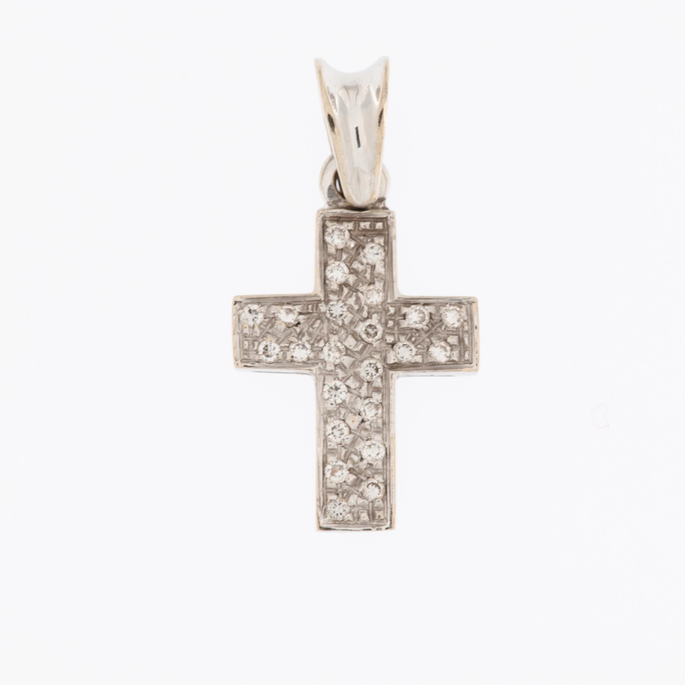 The Vintage Italian 18kt White Gold Cross with Diamonds is a beautiful and timeless piece of jewelry with several distinctive features.

Vintage indicates that the cross is not a modern creation but rather an older piece of jewelry that may have