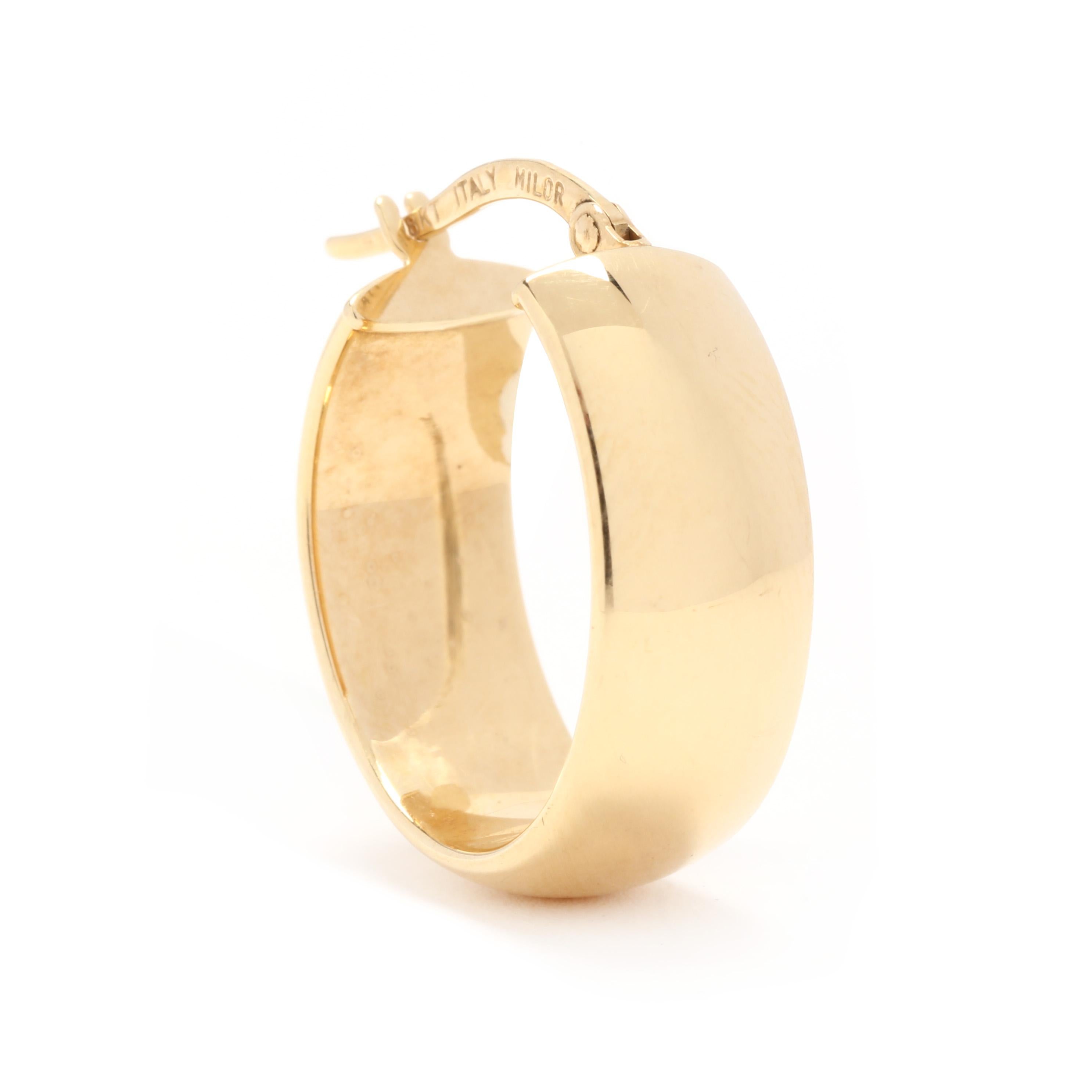 A pair of vintage Italian 18 karat yellow gold flat oval hoop earrings by Milor. These chunky hoops feature a wide flat oval design with pierced snap closures.

Length: 7/8 in.

Width: 5/16 in.

Weight: 1.6 dwts. / 2.49 grams

Stamps: 18K ITALY