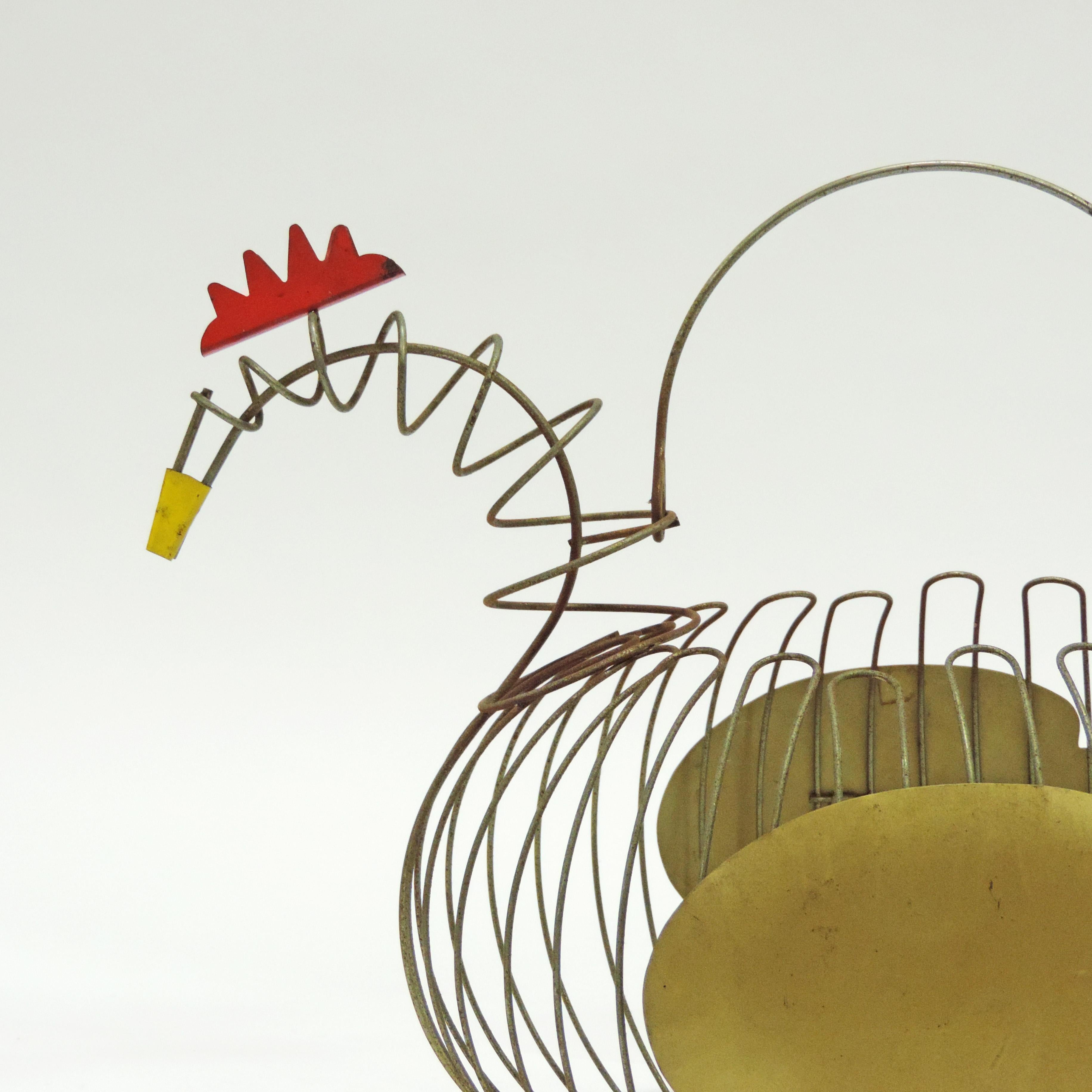 Vintage Italian 1950s egg basket in the shape of a chicken in metal wire and colored aluminium foil decoration.