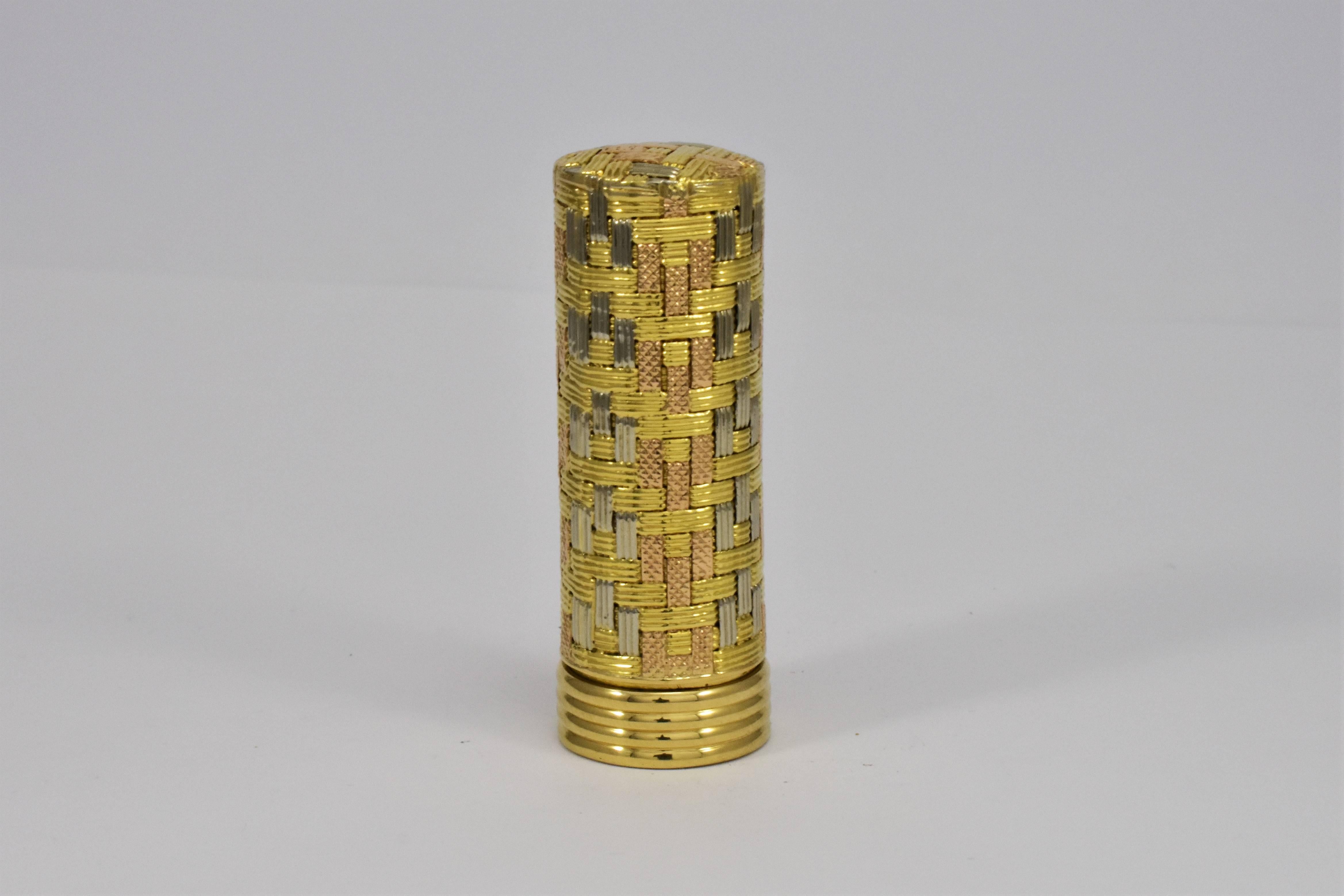 A lipstick cover with a woven detail design combining three colors of yellow, white and rose gold. A chic women's accessory of the 1960s. This small gold container could be re-purposed as a pill box or other precious keepsake box. Made in Italy.