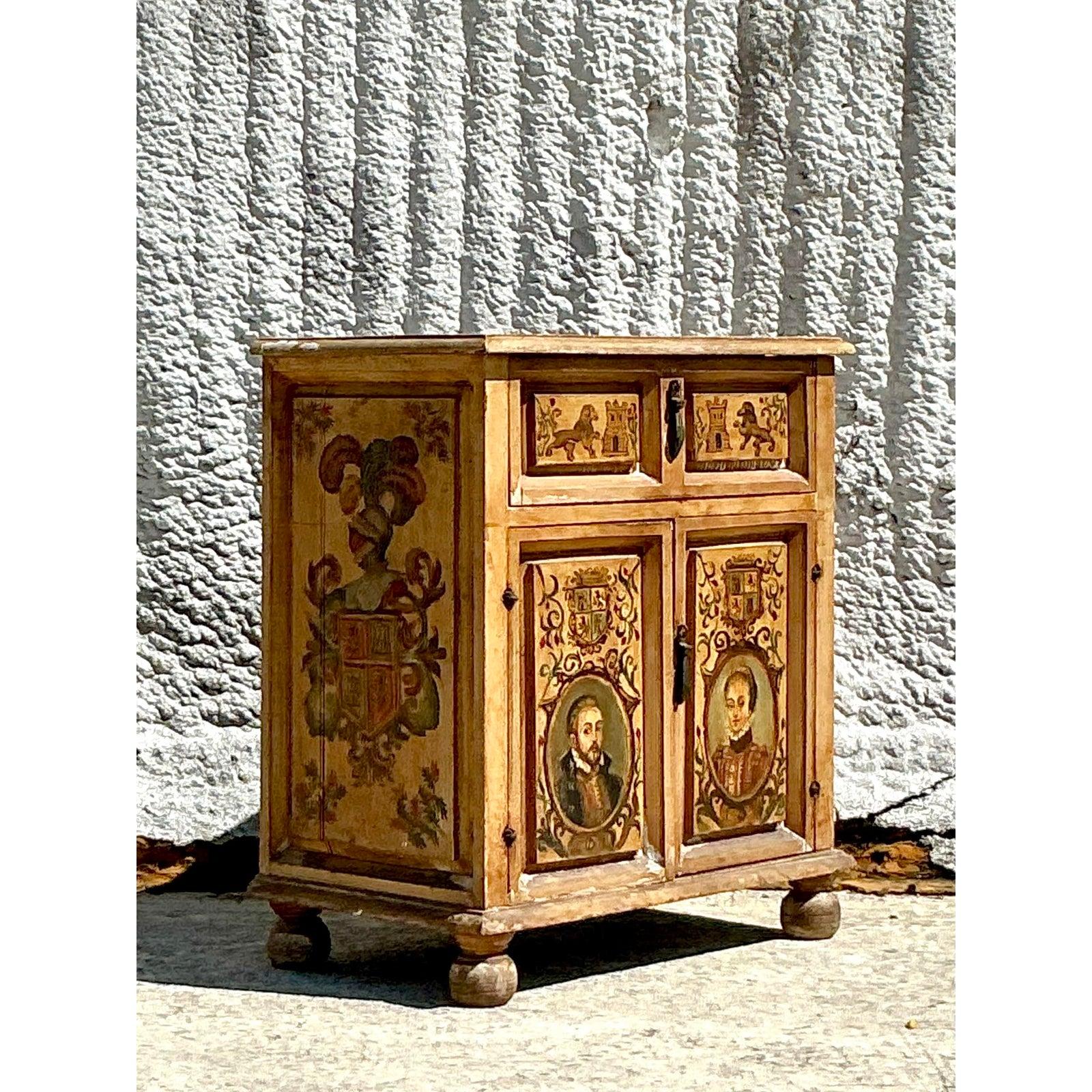 Découvrez le charme de cette armoire vintage italienne du XIXe siècle peinte à la main, une pièce à couper le souffle qui capture l'essence de l'art historique. Orné de portraits méticuleusement peints à la main, de blasons héraldiques et de motifs