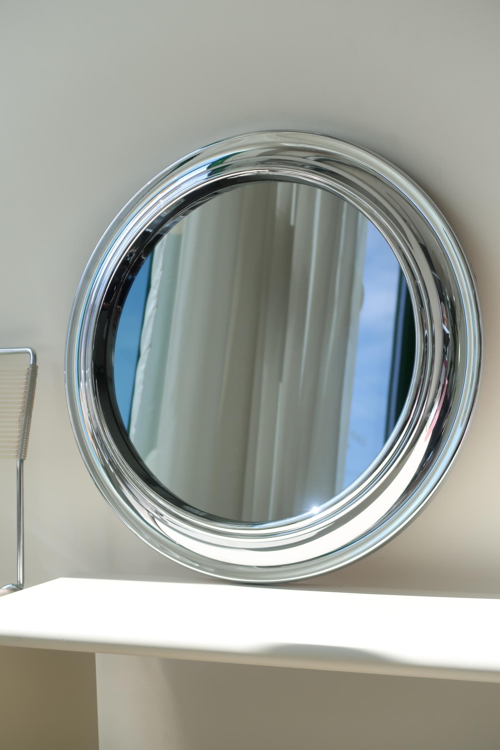 Vintage Italian Space Age mirror in chrome plastic with tinted glass. Designed or inspired by Sergio Mazza for Artemide. Produced in Italy, 1970s, and appears with normal age-related patina. Perfect size for bathroom or entrance hall. Come by our