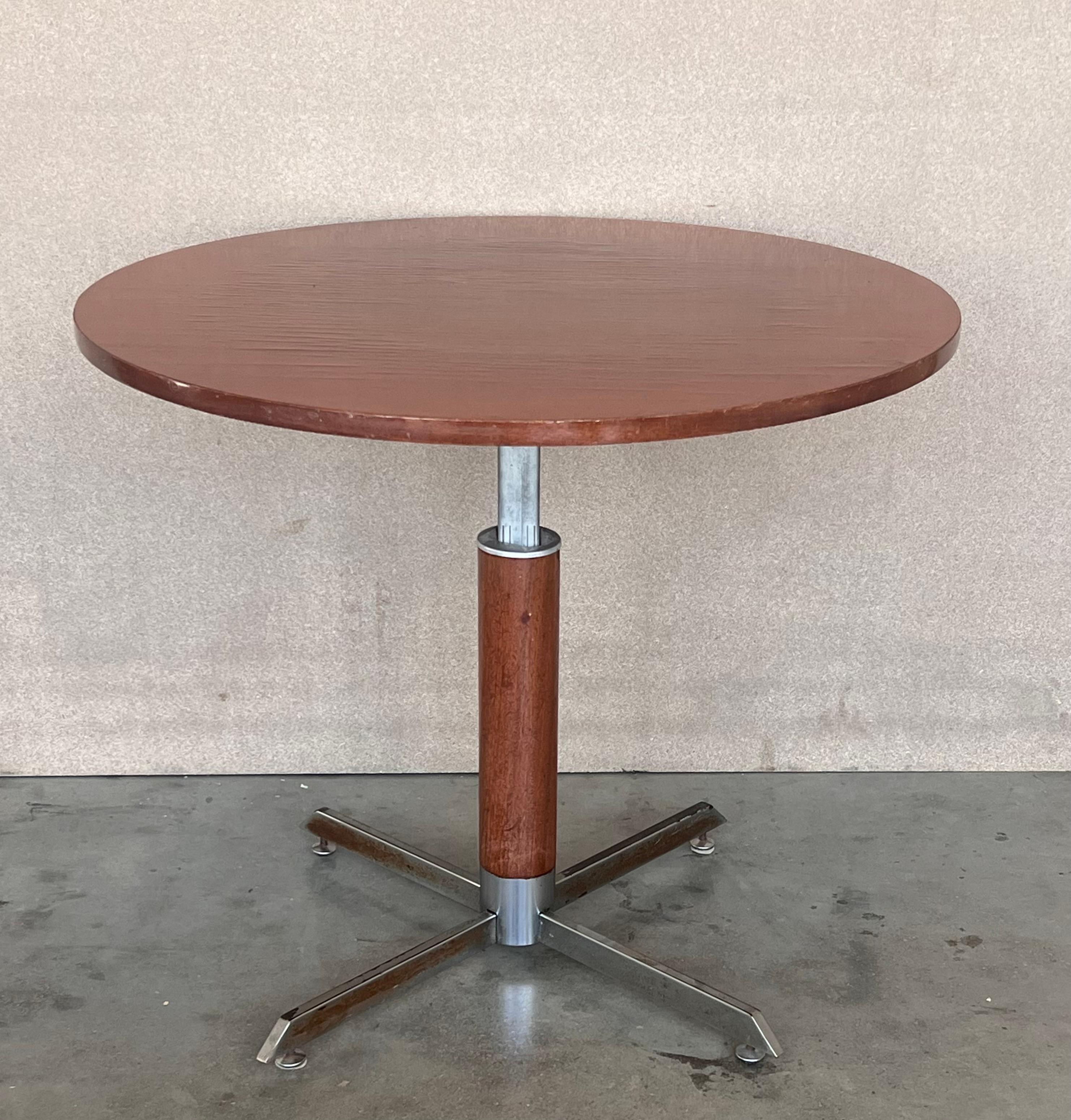 A fine French Art Deco two-tiered mahogany gueridon table supported by three tubular chromed .


Elevable Height: between 26.96in a 24.40in