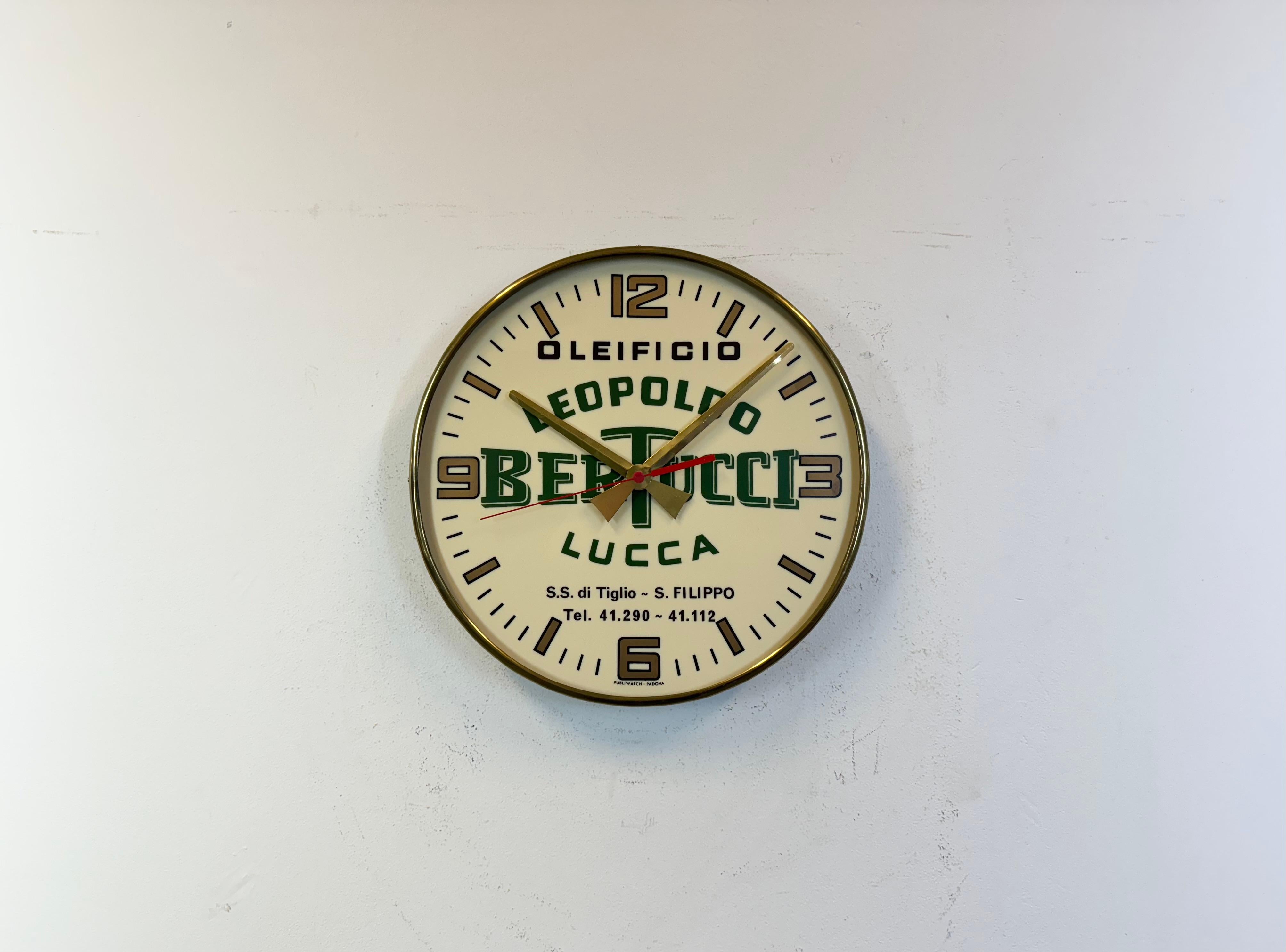 Vintage advertising wall clock made by Publiwatch Padova during the 1970s in Italy. It features a metal body and a plastic dial with aluminium hands.The piece has a battery-powered clockwork and requires only one AA battery. The diameter of the