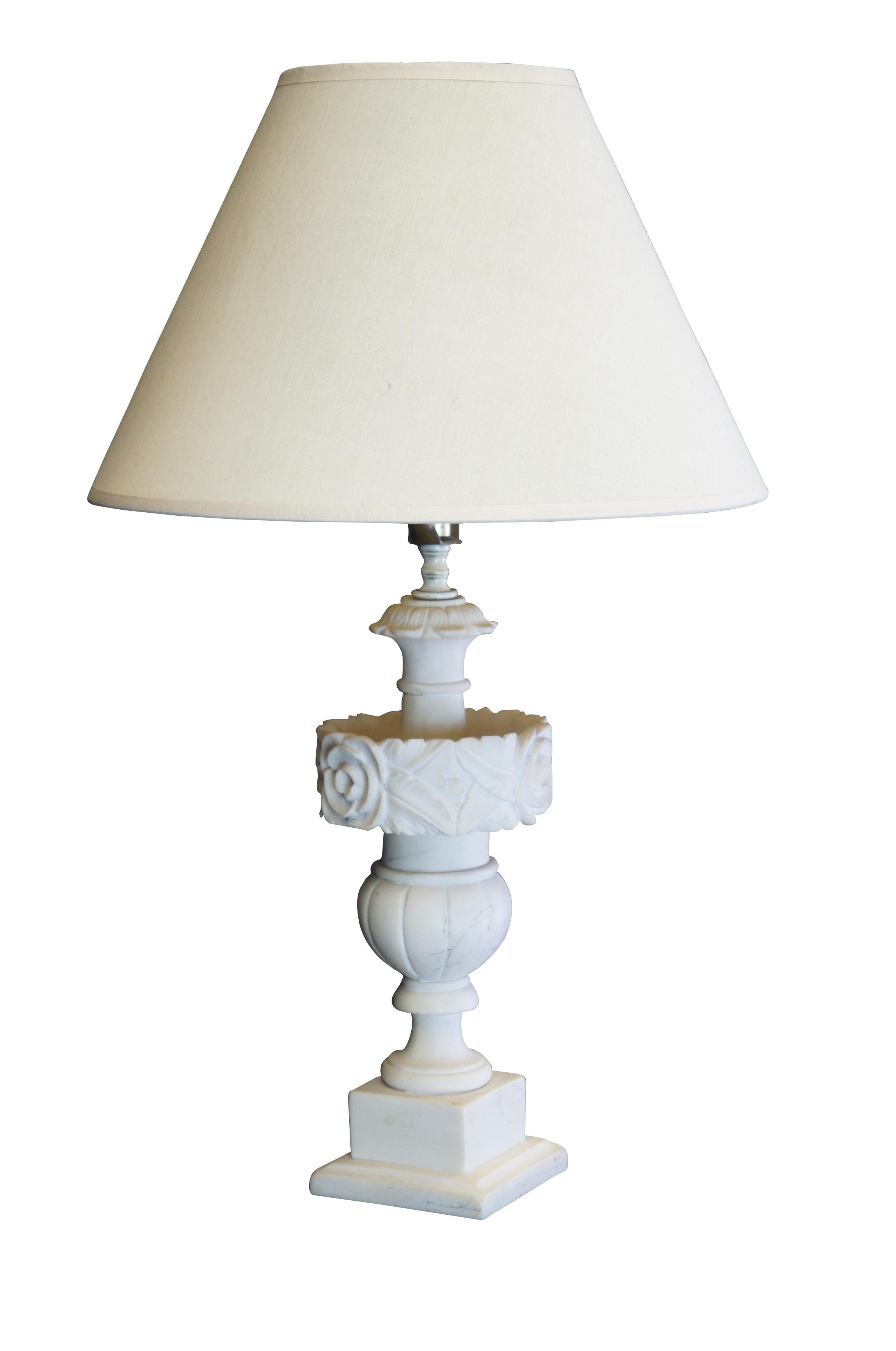 Lovely 20th century Italian carved alabaster table lamp.  Features an urn shape with floral carvings at the center.  Includes Shade.  

Dimensions: 
13