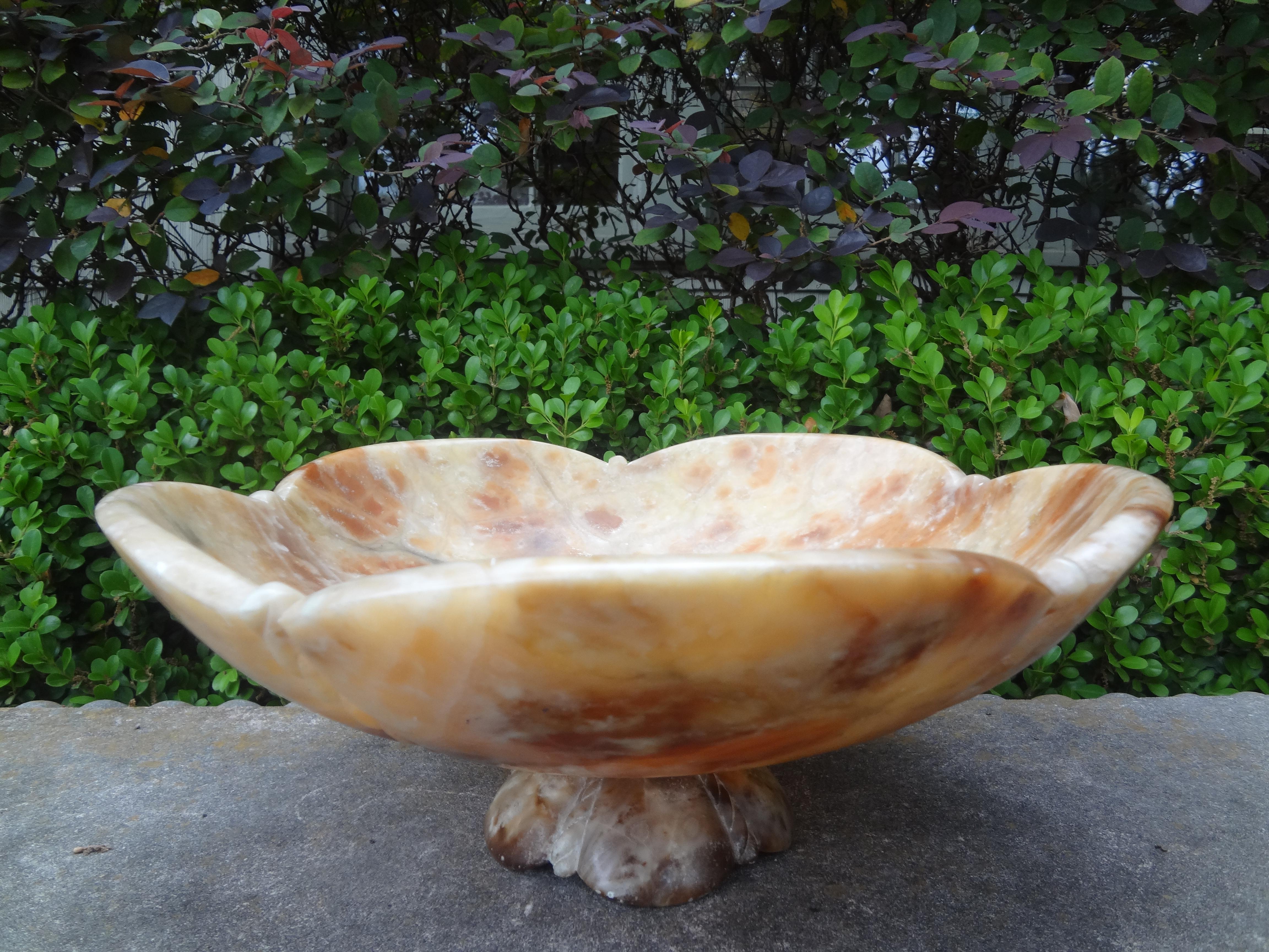 Vintage Italian Alabaster footed bowl or Tazza.
This large shapely Italian bowl, tazza, vide-poche or compote was made of a beautiful honey colored alabaster mounted on a pedestal base.
Great console table, coffee table or bookcase accessory!