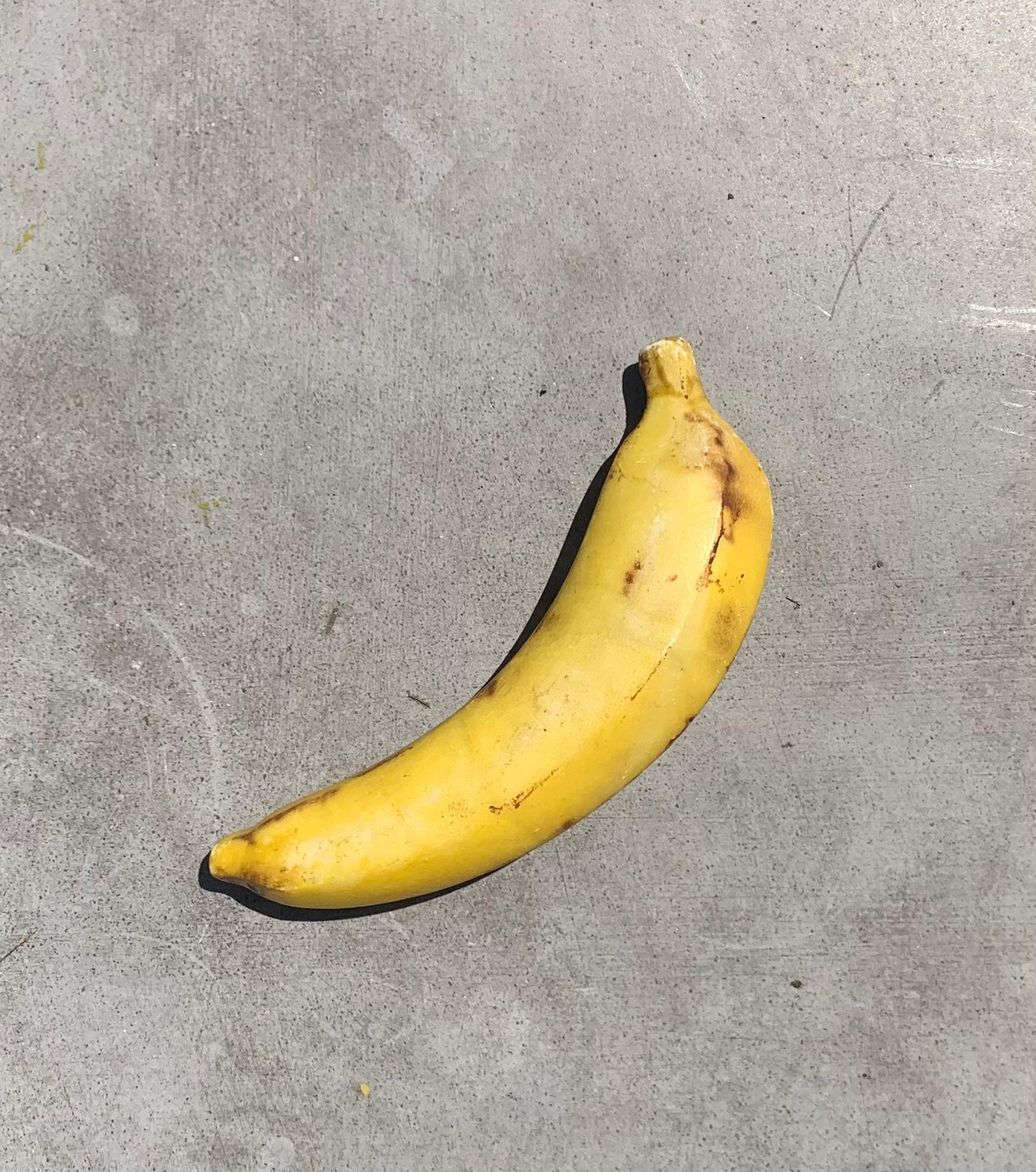 An expertly crafted marble sculpture / objet d’art of a bruised banana. The bruises make it extremely rare; one does see vintage Italian marble fruit but I haven’t come across a bruised banana in all my years. Great as a paperweight, fabulous as a