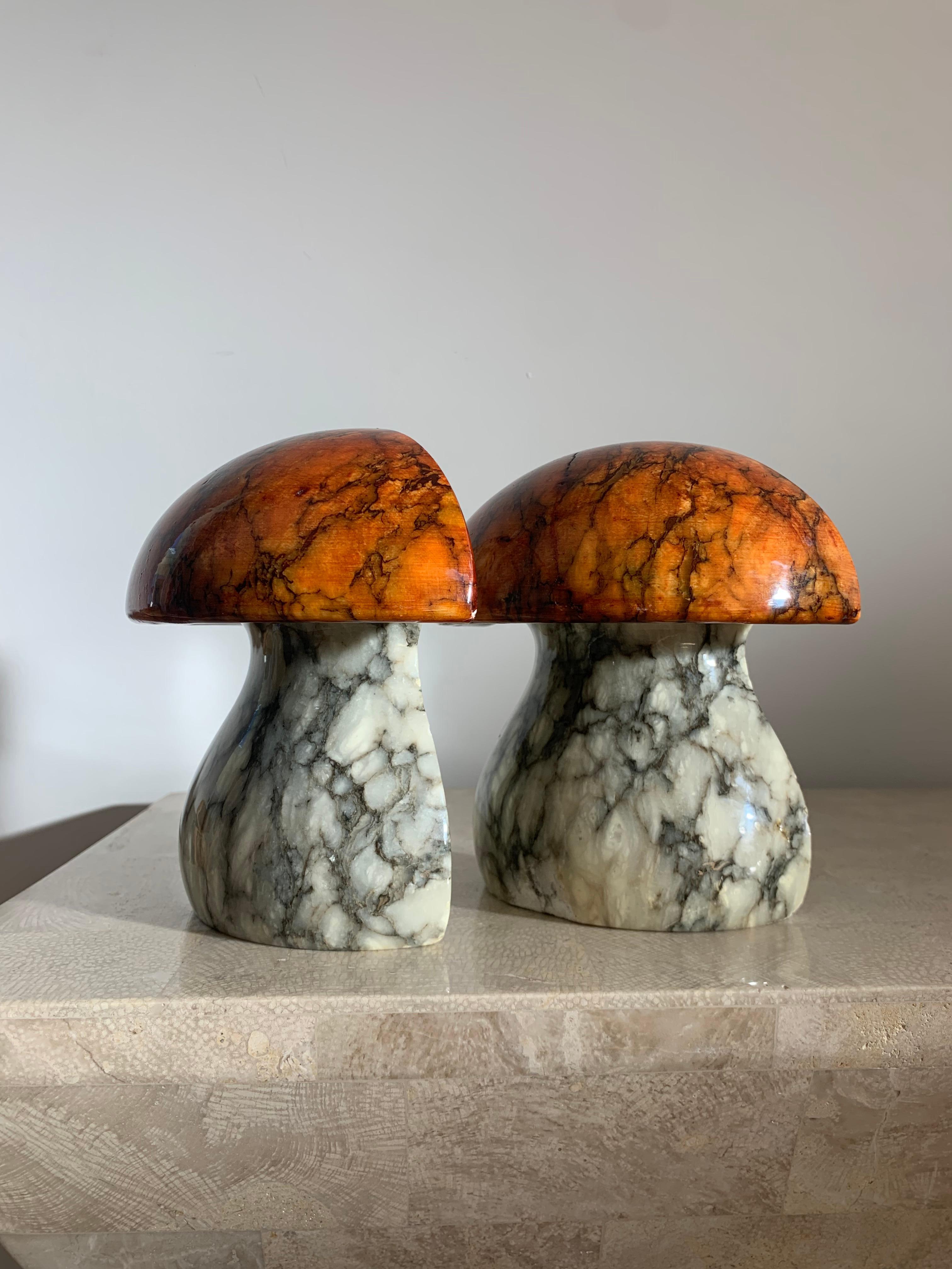 A rare pair of marble mushroom bookends by ABF, hand-carved in Italy 1960s. Sculptures / objets d’arts in their own right. Stems are ivory with ash veining, whilst caps are a brilliant coral red with charcoal veining. Minor losses as photos attest.