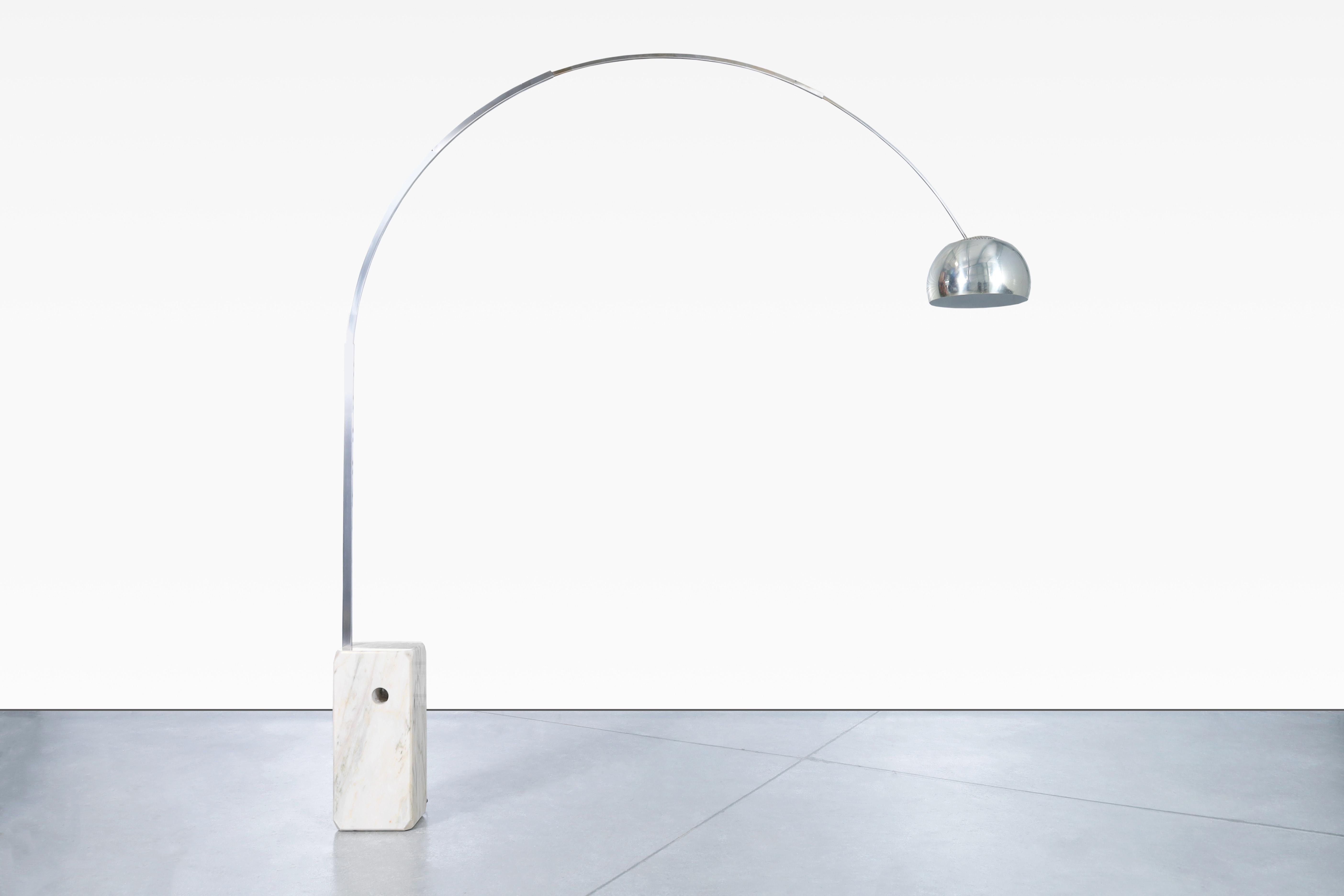 Amazing vintage Italian “Arco” marble floor lamps, designed by Achille and Pier Castiglioni for Flos in Italy, circa 1960s. This stunning lamp is a testament to refined design, showcasing a beautiful Carrera marble base and a fusion of aluminum and