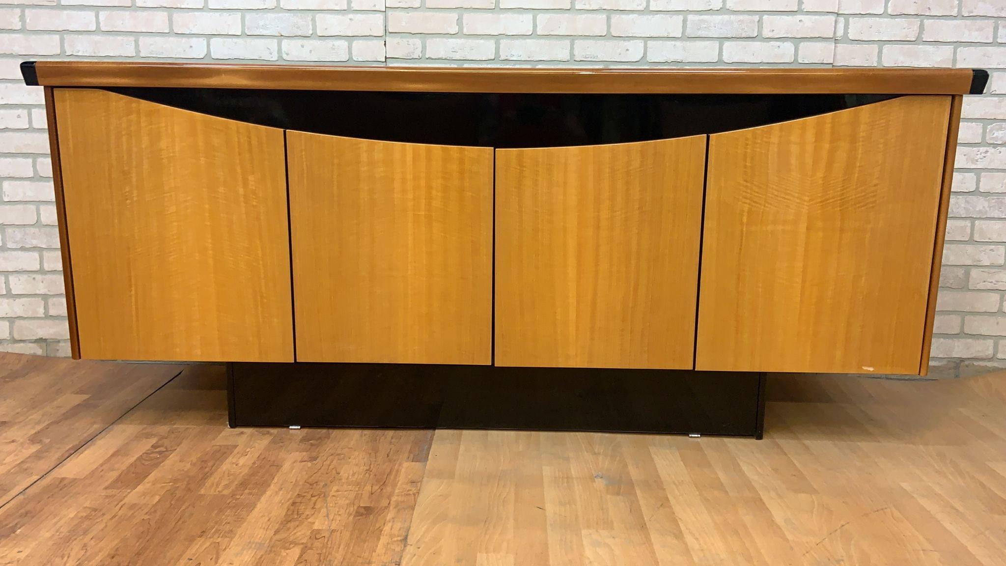 Vintage Italian Art Deco Birdseye Maple and Satinwood Black Lacquered Sideboard/Credenza

Gorgeous vintage Italian art deco sleek & chic maple/satinwood console with black piano lacquered trim. The cabinet has 4 doors, 2 shelves and a bottom center