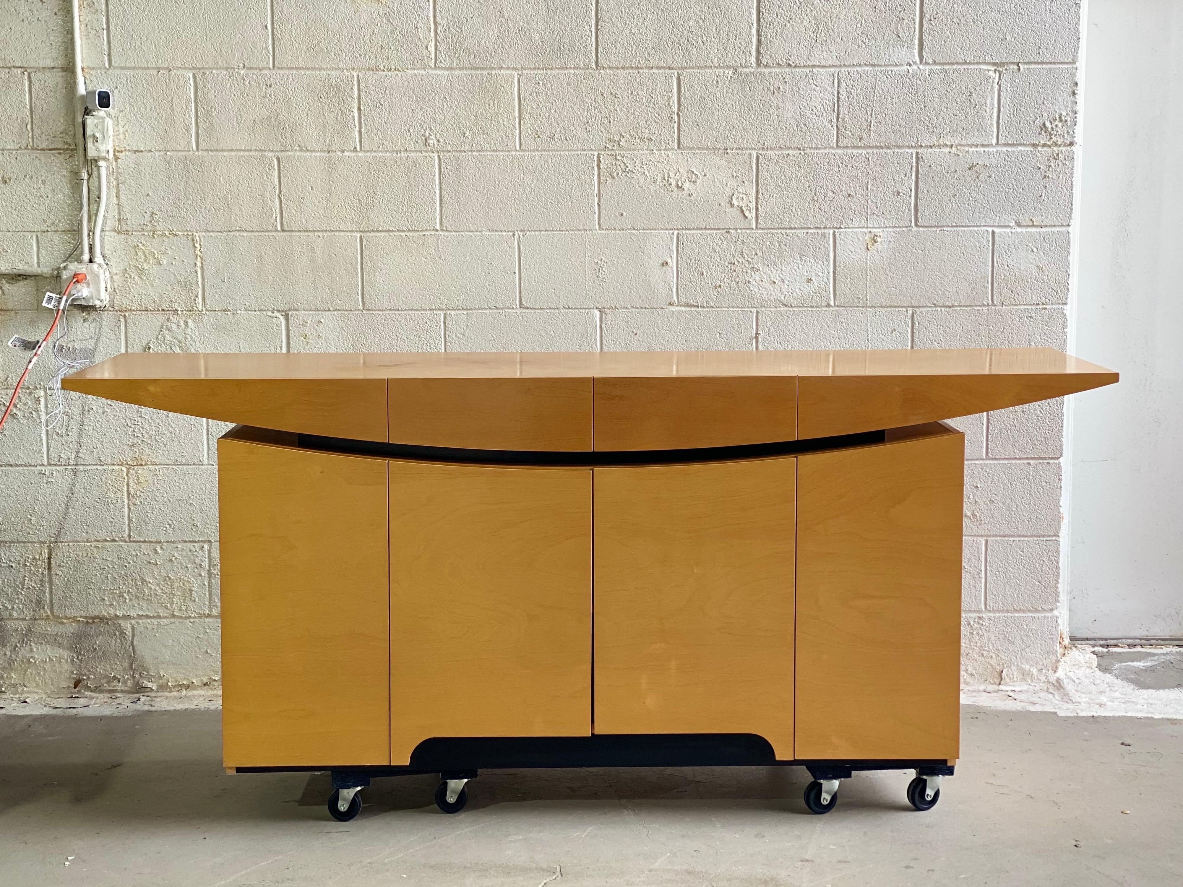 We are very pleased to offer an exquisite sideboard, circa the 1980s.  This piece perfectly embodies the Italian Art Deco style, distinguished by simple, clean shapes, with a “streamlined” look, and ornamentation that is geometric.  Showcasing a