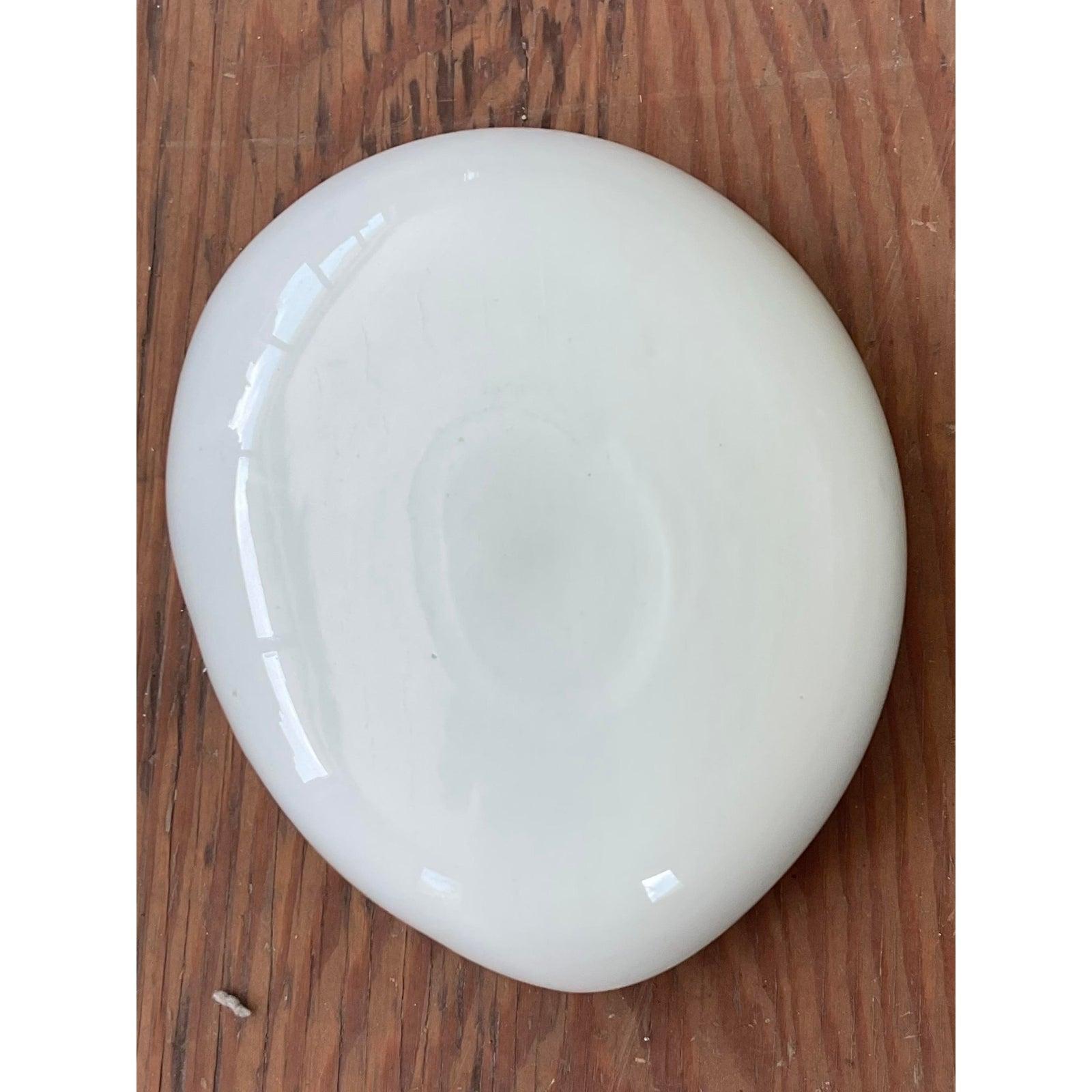 A stunning example of mid-century Italian art glass, this exquisite hand-blown bowl captures the light and the eye with its masterful design. Meticulously crafted, it features a captivating interior of shimmering gold or copper avventurina flecks